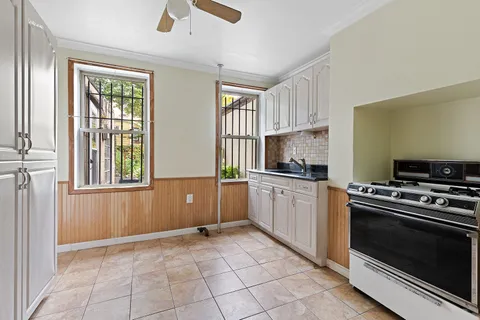 a kitchen with a stove a sink and a microwave