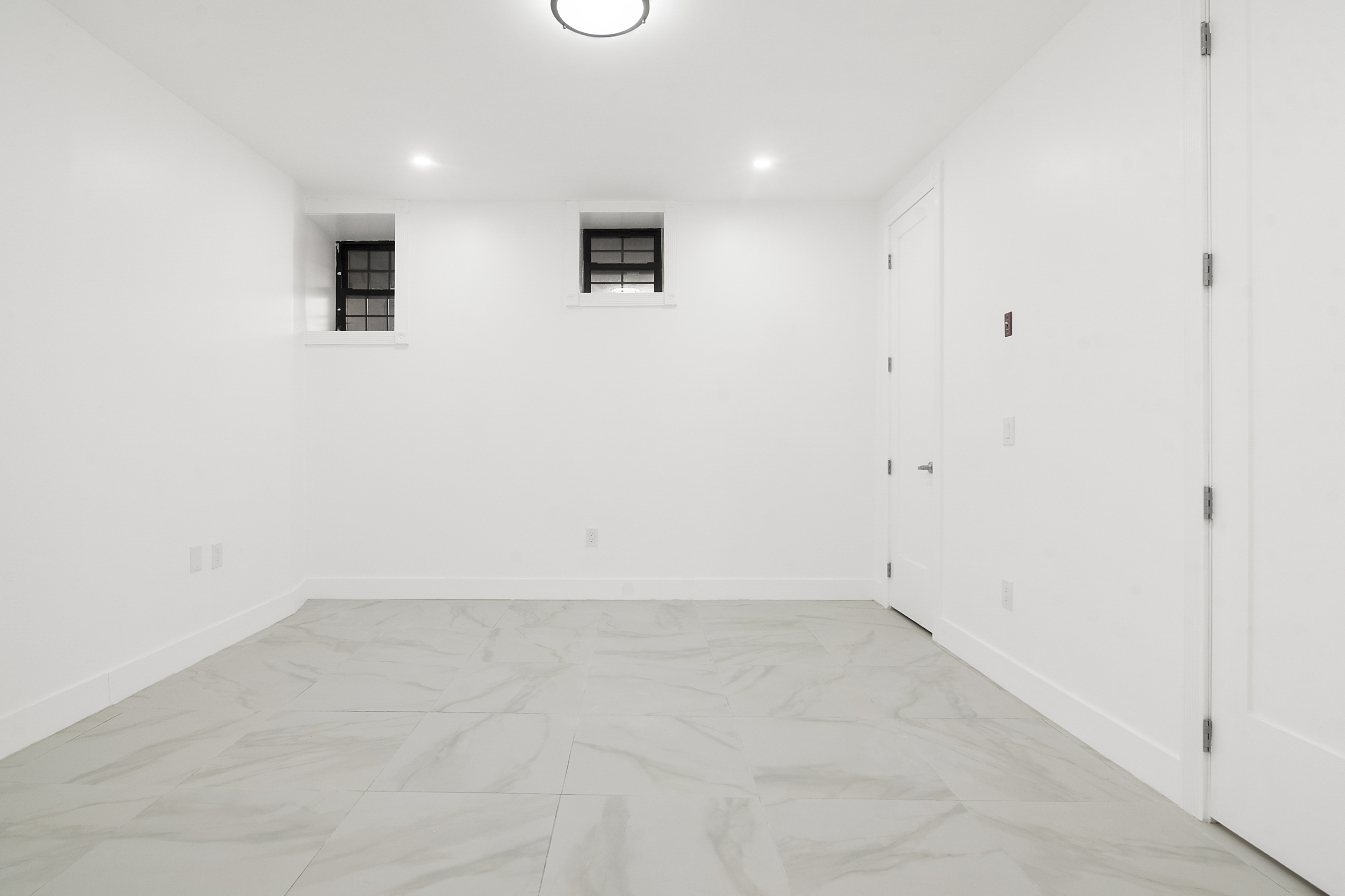 1085 Hancock Street Brooklyn, NY 11221 - Photo 8 of 9 an empty room with windows