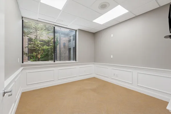 a view of an empty room with a window
