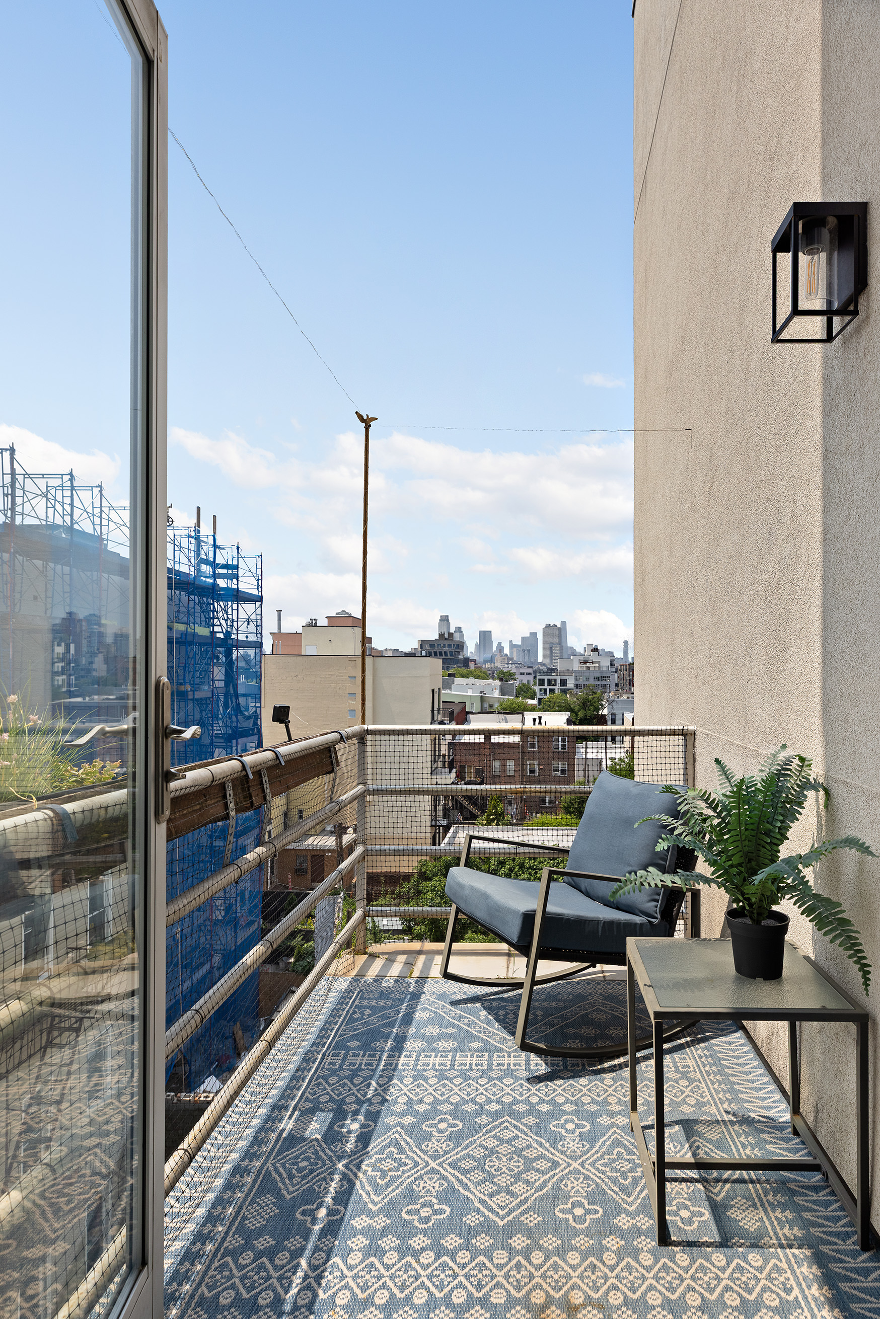 447 Humboldt Street, Unit PHB Brooklyn, NY 11211 - Photo 5 of 10 a terrace with outdoor seating and city view