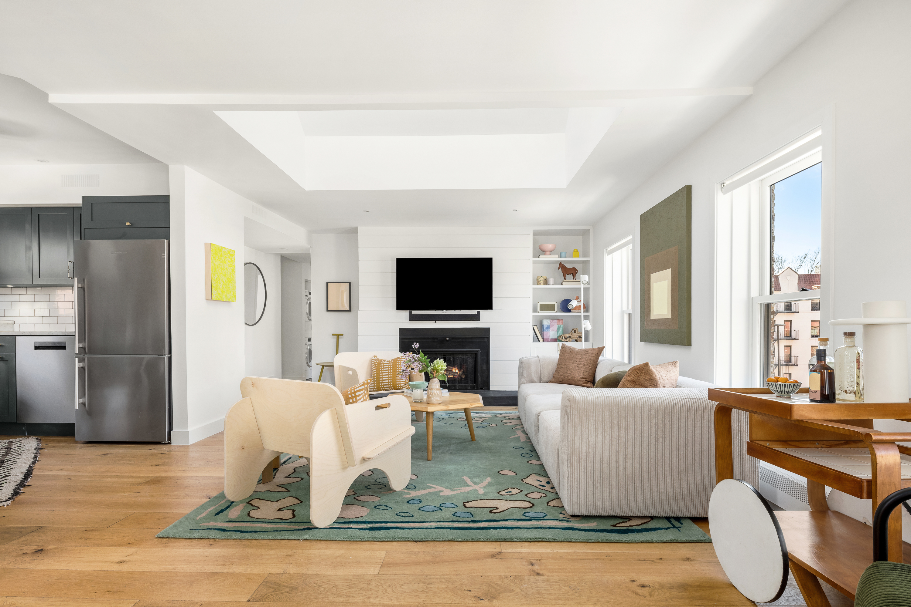 160 West 11th Street, Unit PH Manhattan, NY 10011 - Photo 7 of 16 a living room with furniture and a flat screen tv