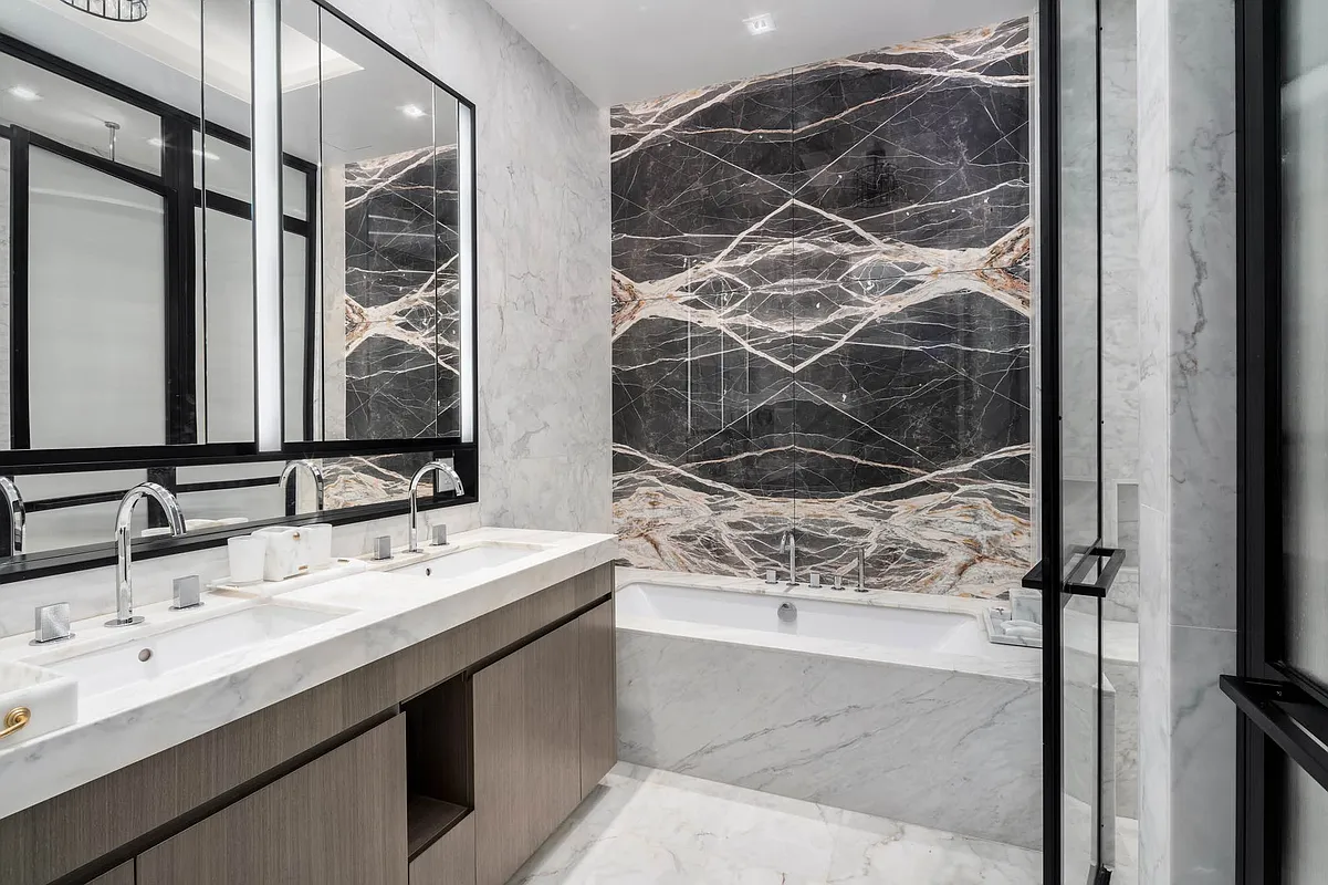 108 Leonard Street, Unit 5A Manhattan, NY 10013 - Photo 6 of 21 a bathroom with a sink and a mirror