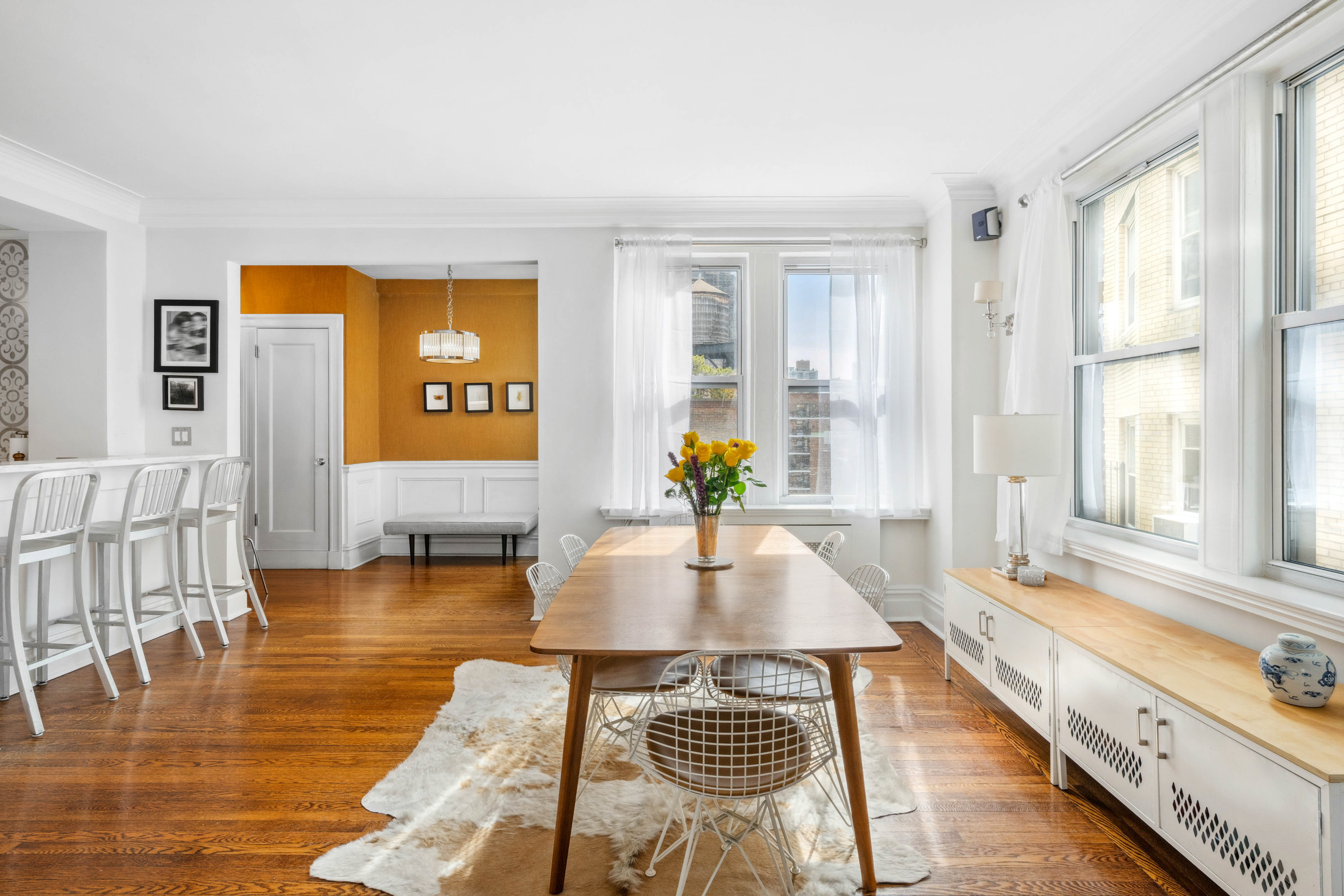 136 East 36th Street, Unit 9/10C Manhattan, NY 10016 - Photo 9 of 27 a living room with furniture and wooden floor