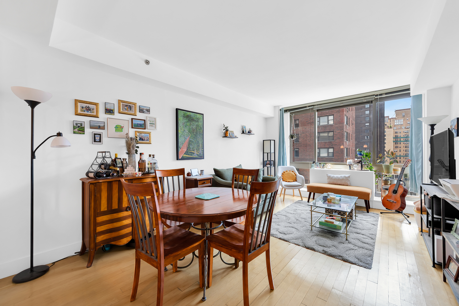 242 East 25th Street, Unit 9B Manhattan, NY 10010 - Photo 3 of 6 a view of a dining room with furniture window and outside view