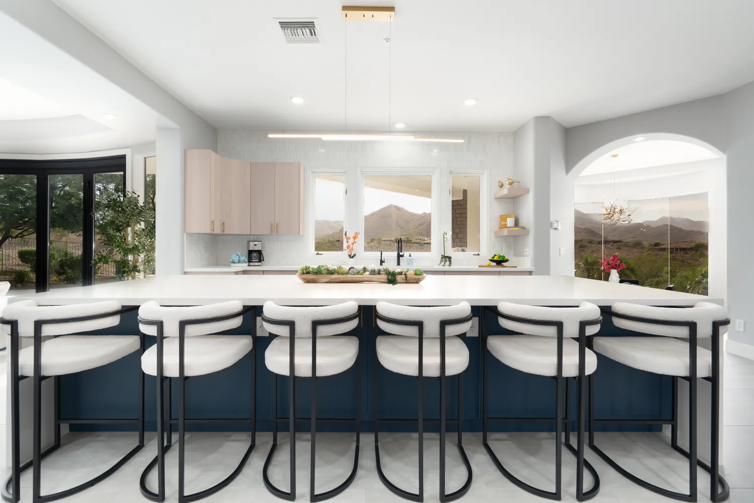 a kitchen with a table and chairs in it