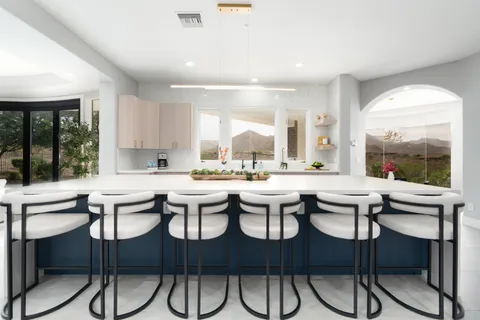 a kitchen with a table and chairs in it