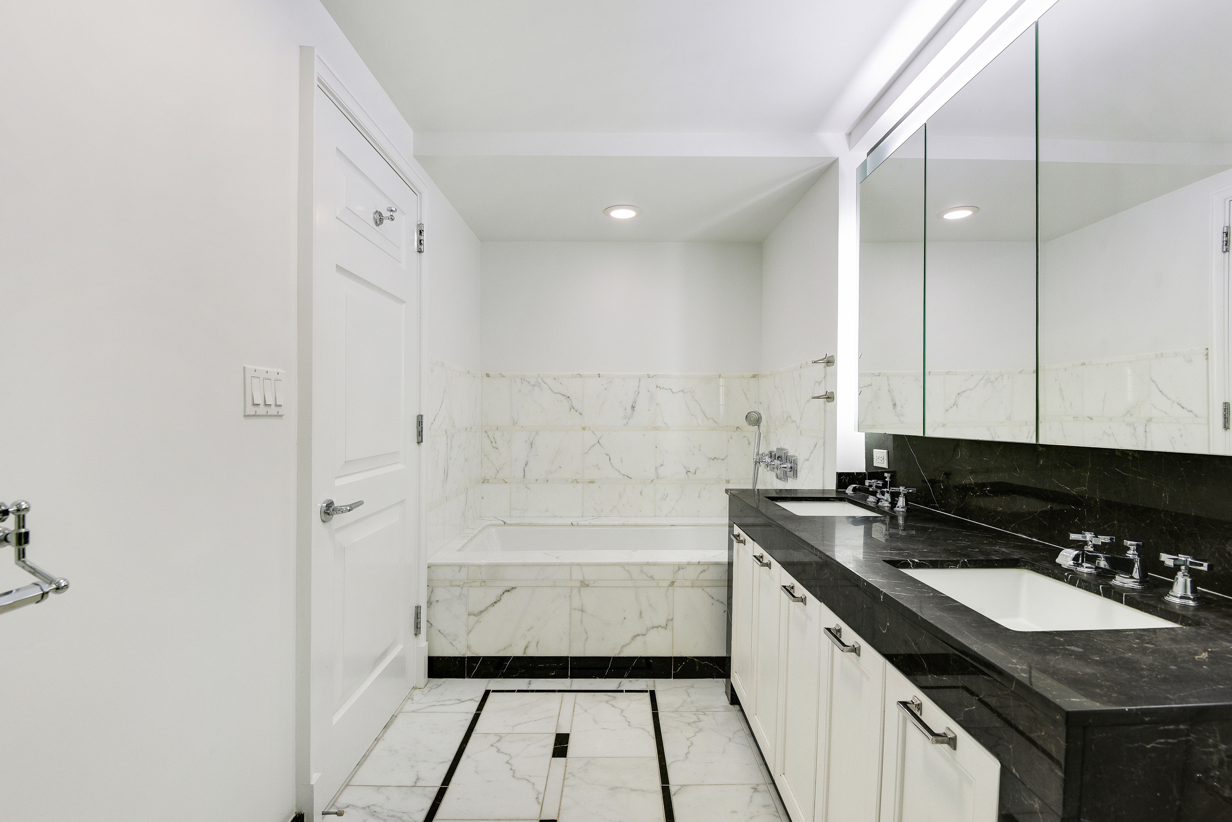 205 East 85th Street, Unit 12H Manhattan, NY 10028 - Photo 14 of 19 a kitchen with a sink and cabinets