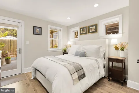 a bedroom with a large bed and a window