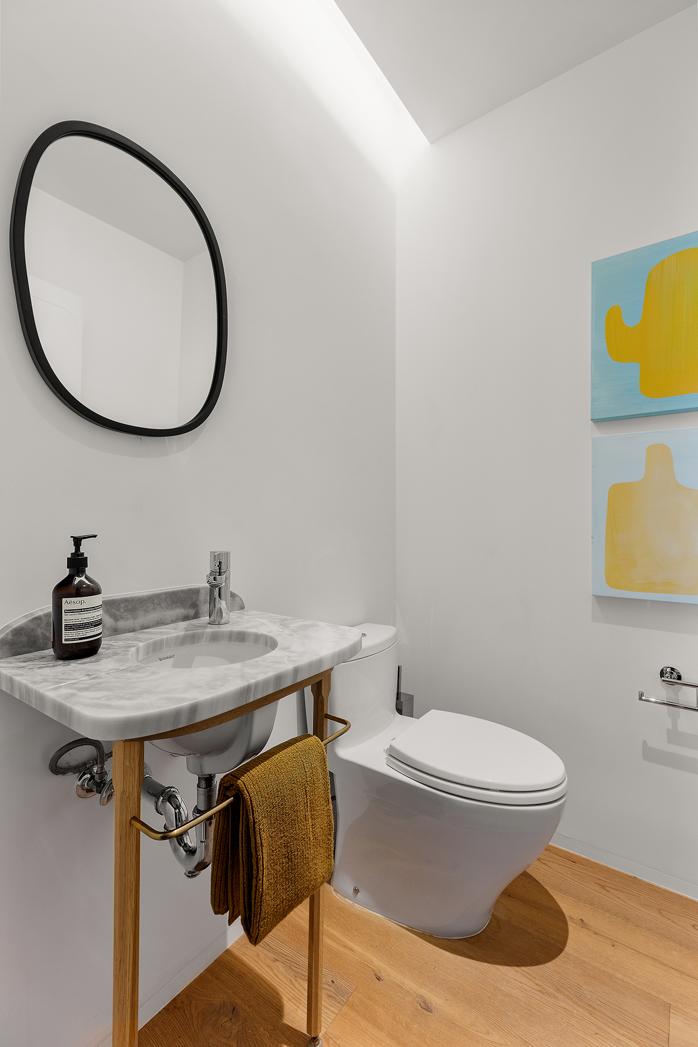 325 West Broadway, Unit 4B Manhattan, NY 10013 - Photo 12 of 17 a bathroom with a toilet a sink and mirror