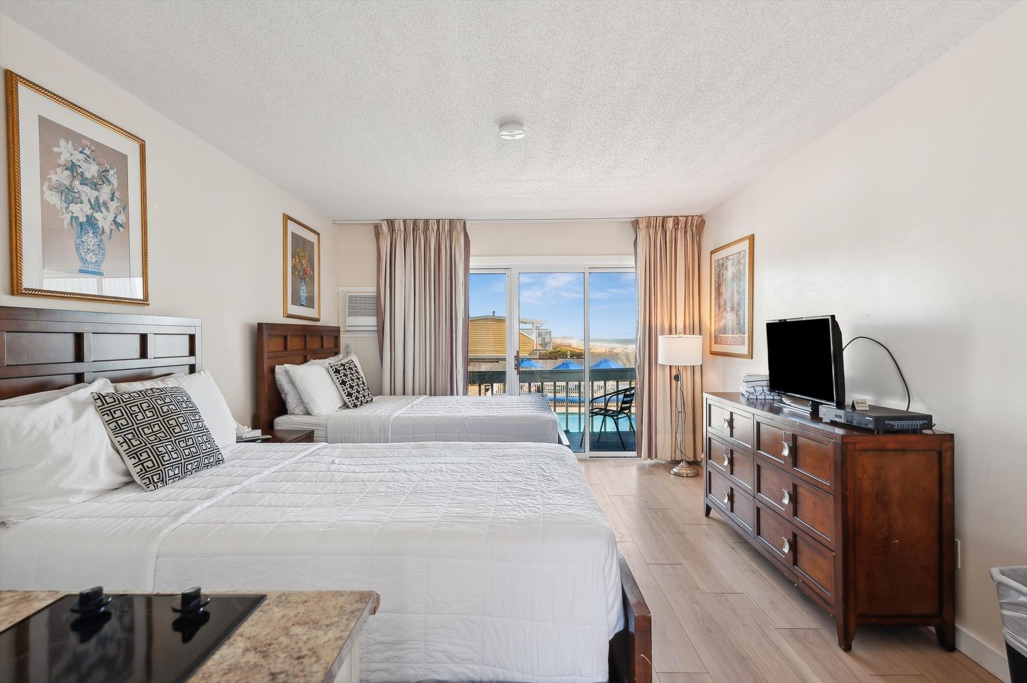 a very nice looking room with a large window and a wooden floor