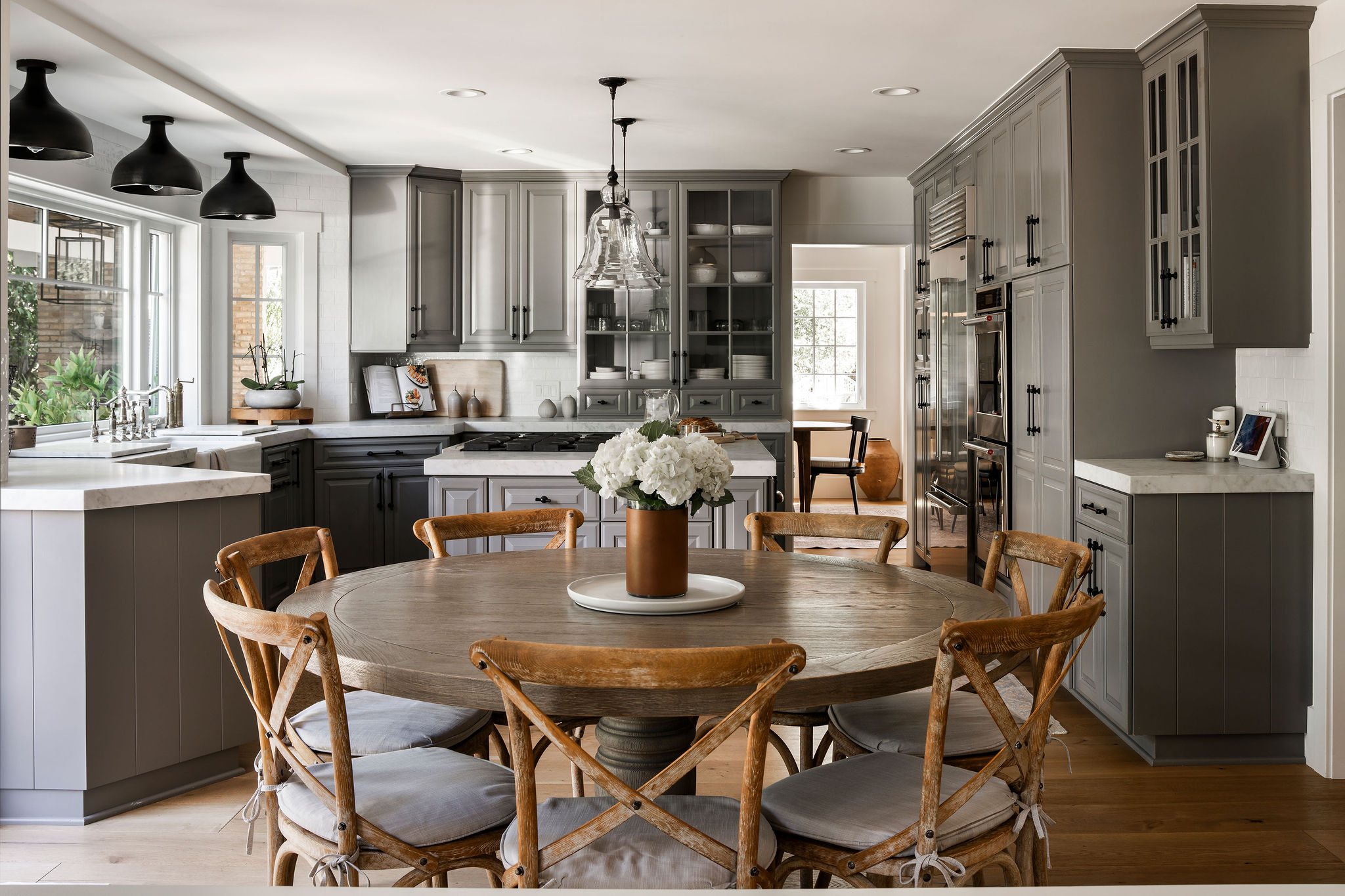 560 Cold Canyon Road Calabasas, CA 91302 - Photo 14 of 84 a dining room with stainless steel appliances granite countertop a table chairs and a refrigerator