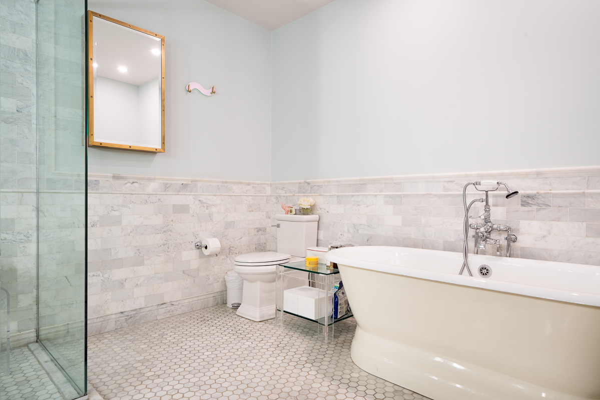 481 Washington Street, Unit 6N Manhattan, NY 10013 - Photo 9 of 10 a bathroom with a sink a toilet and bathtub