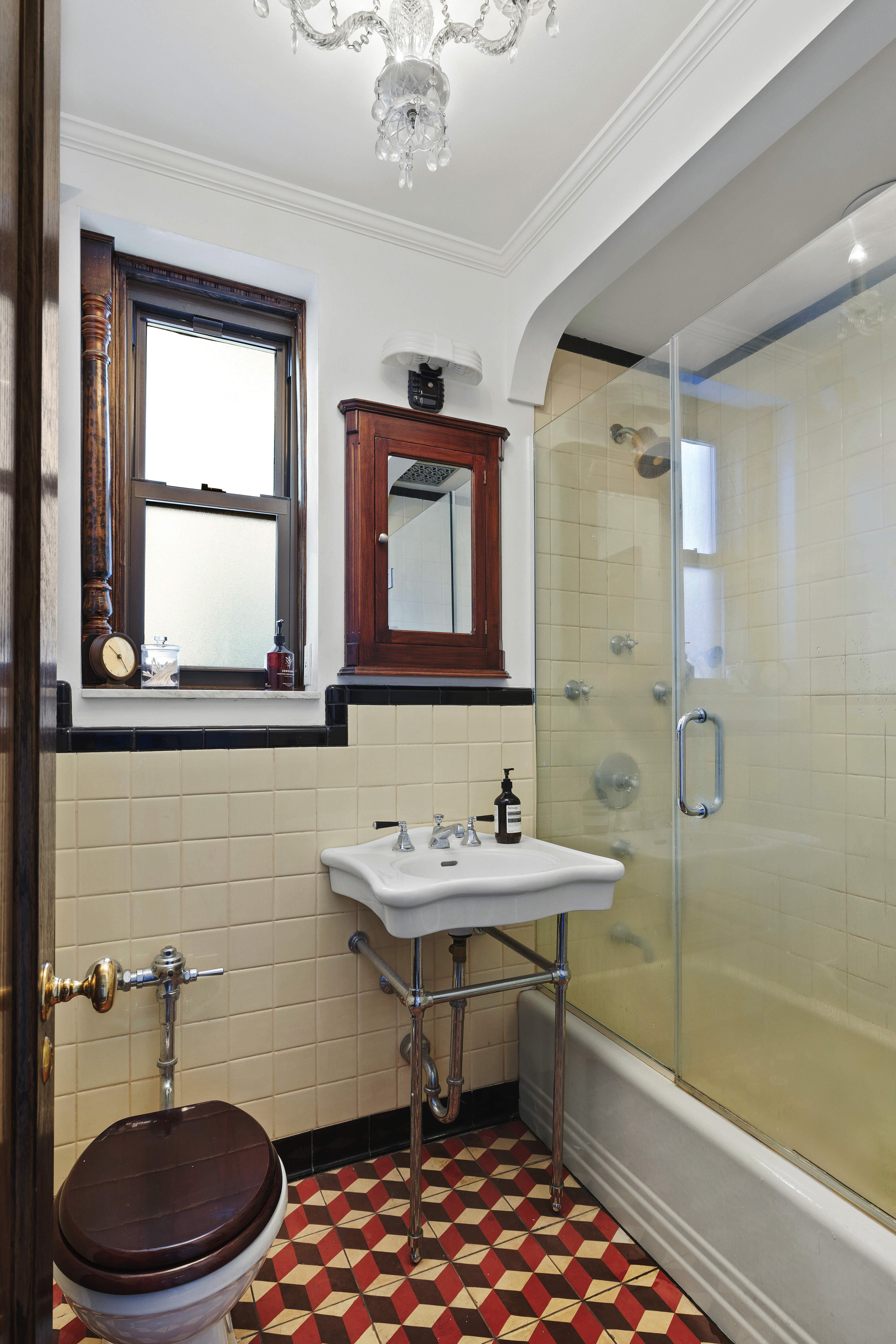 125 Ocean Avenue, Unit 2G Brooklyn, NY 11225 - Photo 13 of 16 a bathroom with a sink a toilet and shower