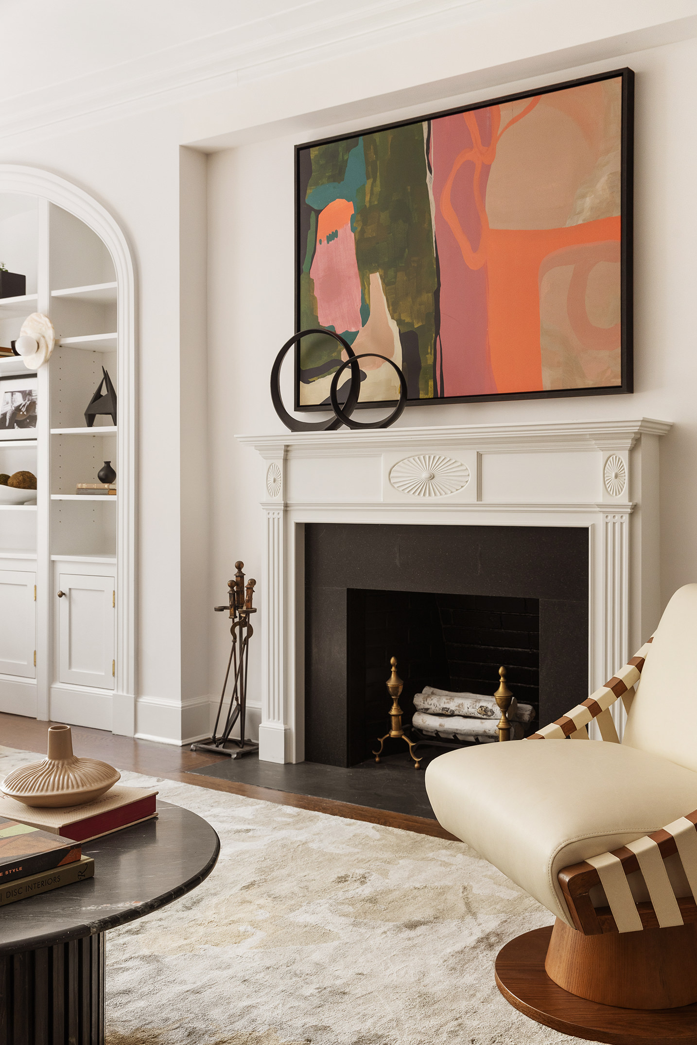 115 East 67th Street, Unit 3C Manhattan, NY 10065 - Photo 3 of 21 a living room with furniture and a fireplace