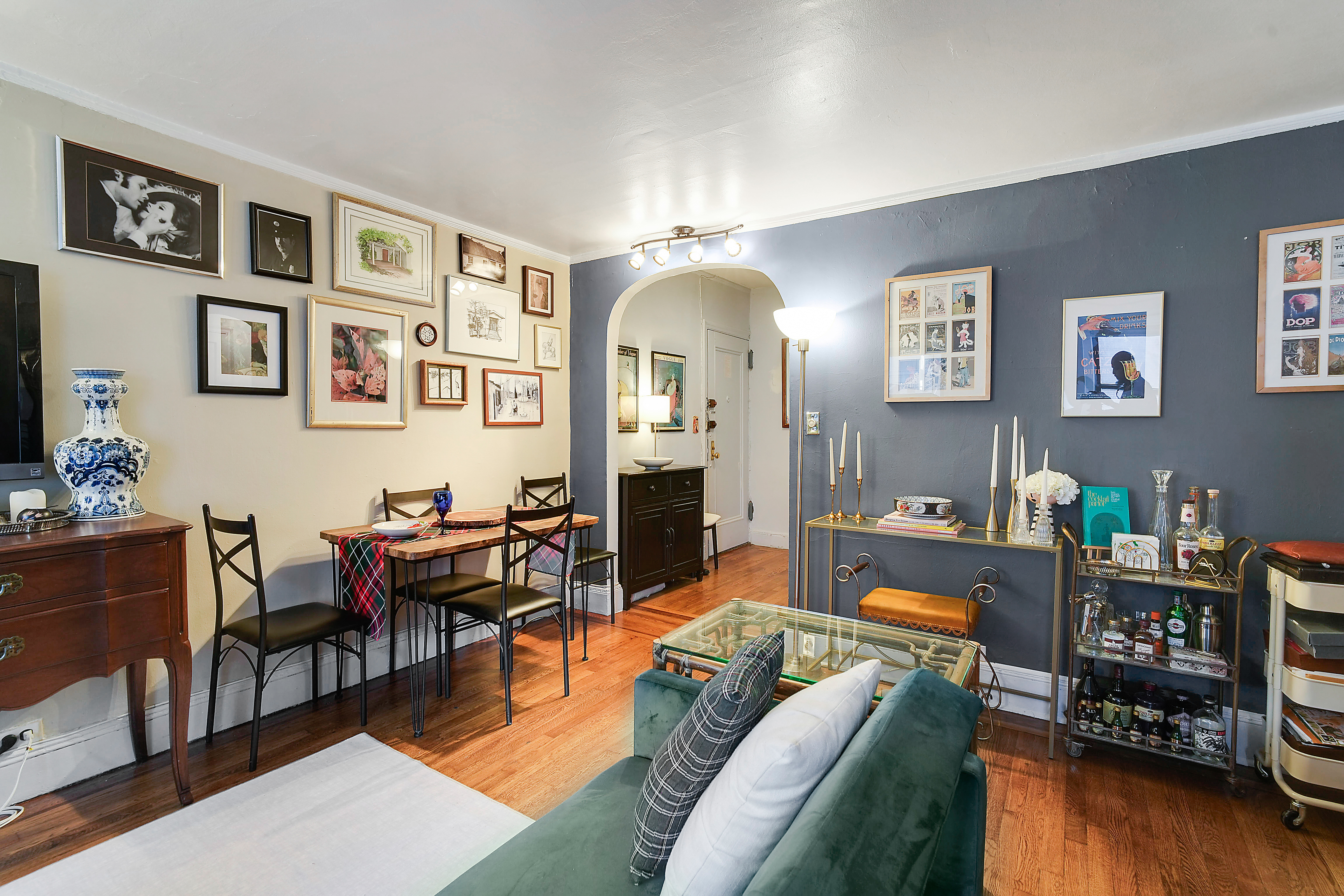 240 East 24th Street, Unit 4G Manhattan, NY 10010 - Photo 2 of 10 a living room with furniture and wooden floor