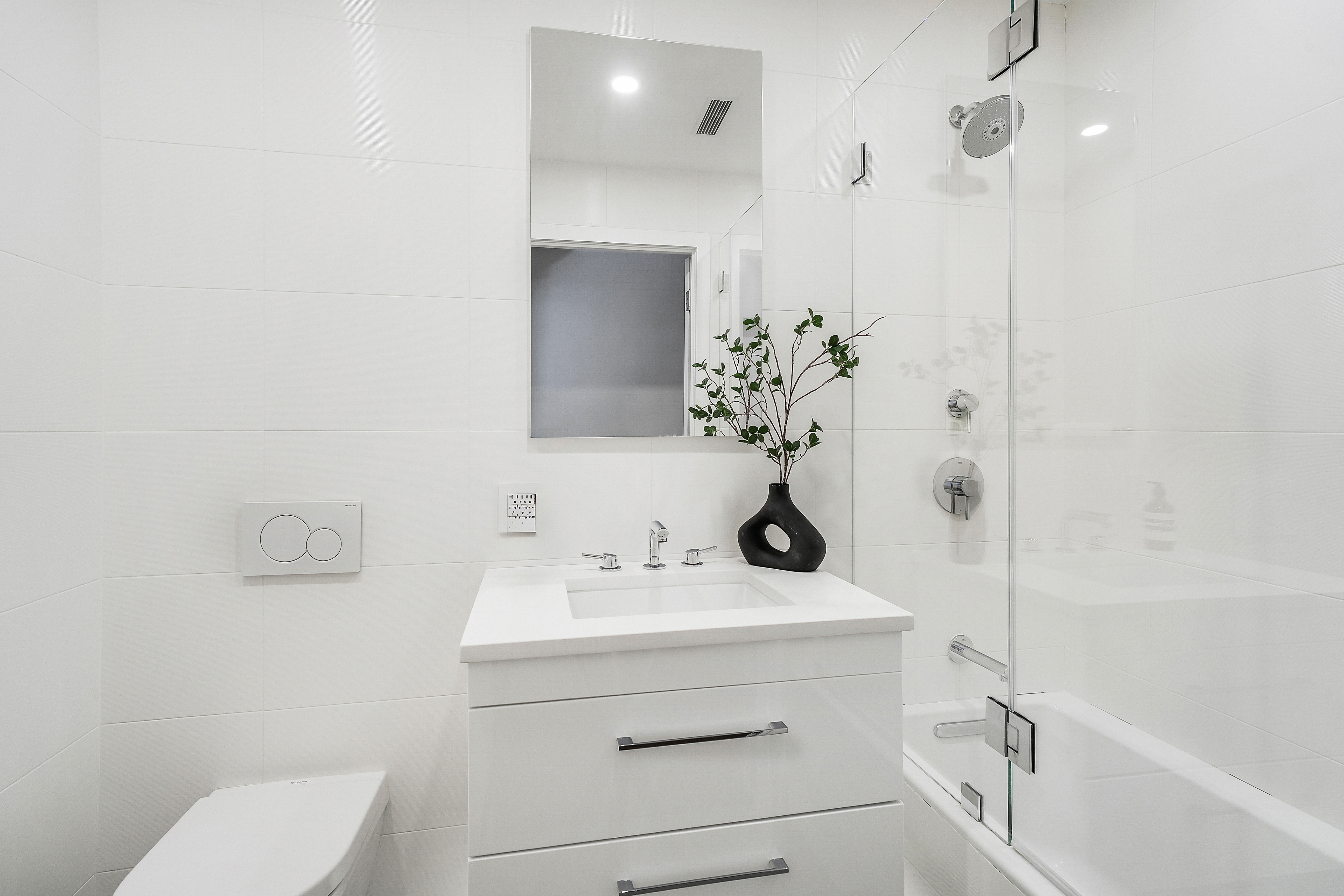 215 West 88th Street, Unit 3E Manhattan, NY 10024 - Photo 8 of 16 a bathroom with a sink toilet and shower
