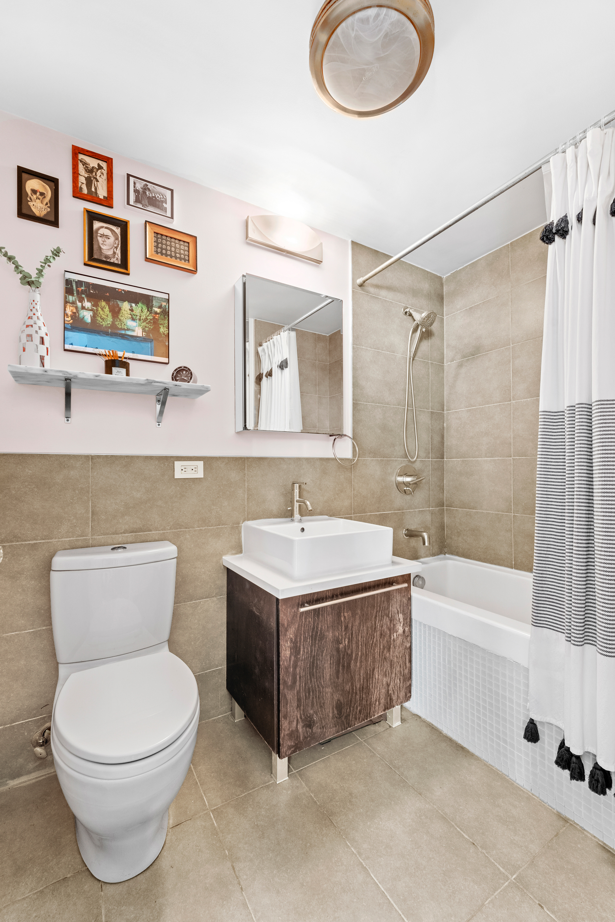 151 Manhattan Avenue, Unit 4B Brooklyn, NY 11206 - Photo 9 of 11 a bathroom with a sink a toilet and a bathtub