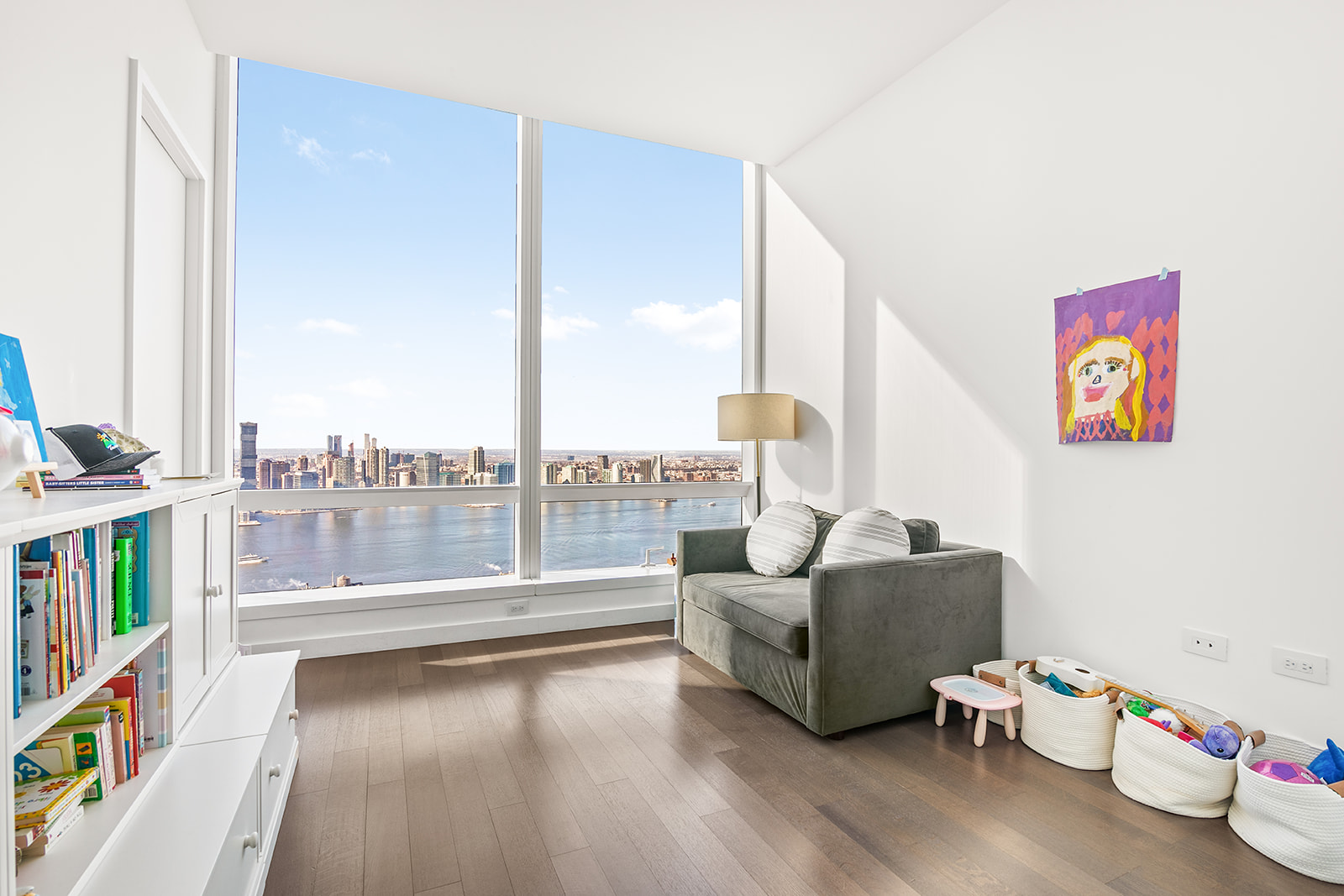 111 Murray Street, Unit 44W Manhattan, NY 10007 - Photo 7 of 17 a living room with furniture and a floor to ceiling window