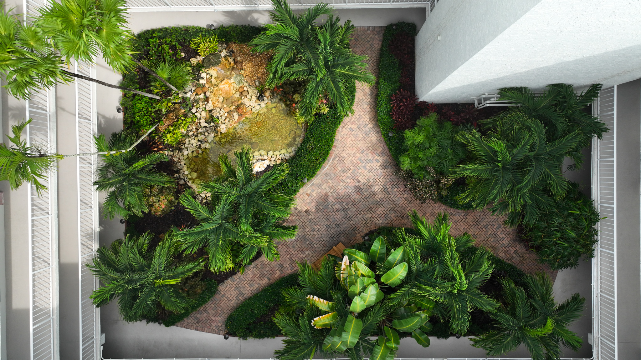 4601 Highway A1a, Unit 102 Vero Beach, FL 32963 - Photo 18 of 29 a view of a yard with plants