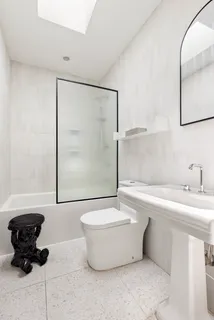 a bathroom with a bathtub and a sink