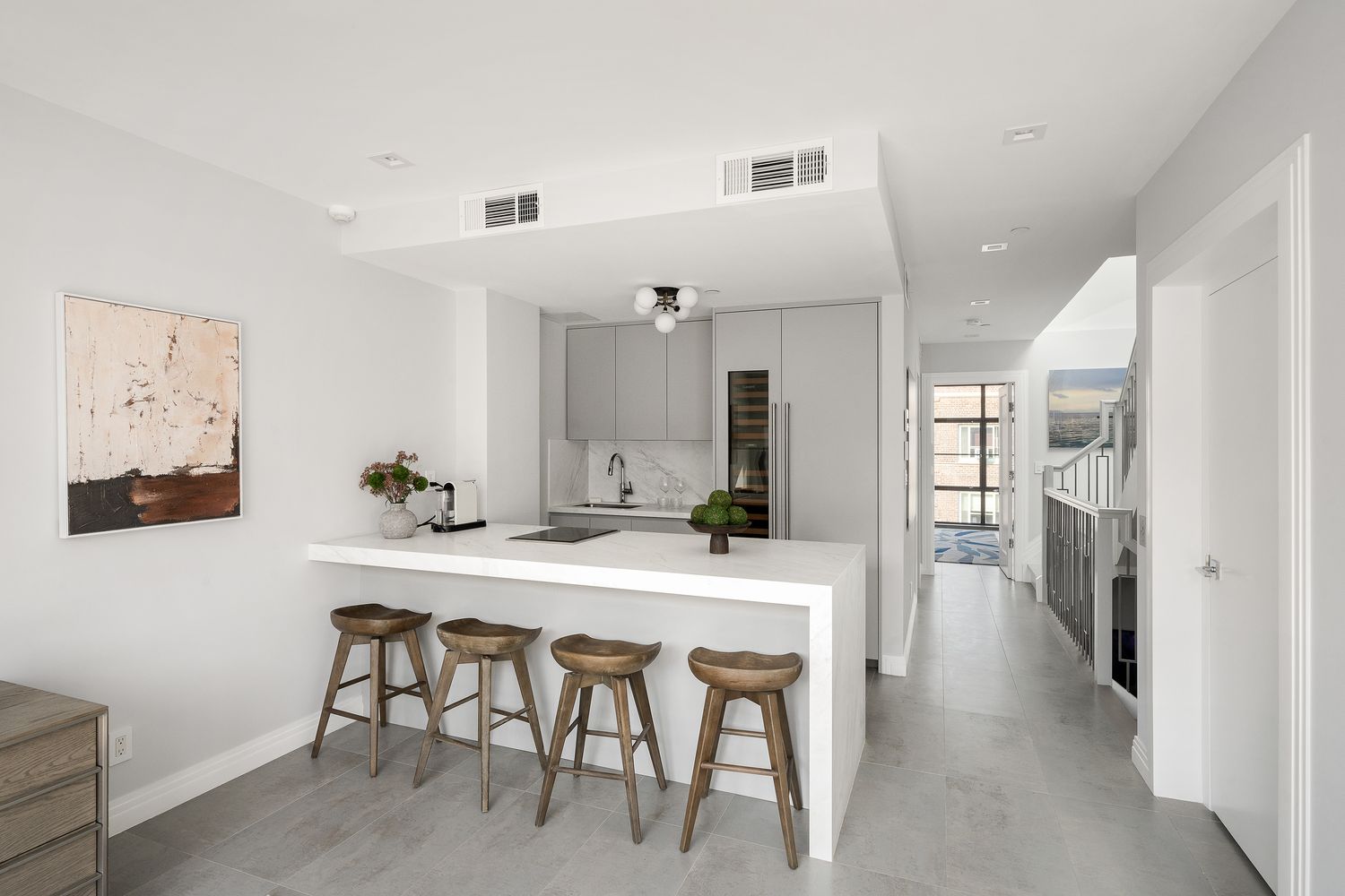 520 East 89th Street Manhattan, NY 10128 - Photo 14 of 40 a large white kitchen with a table and chairs