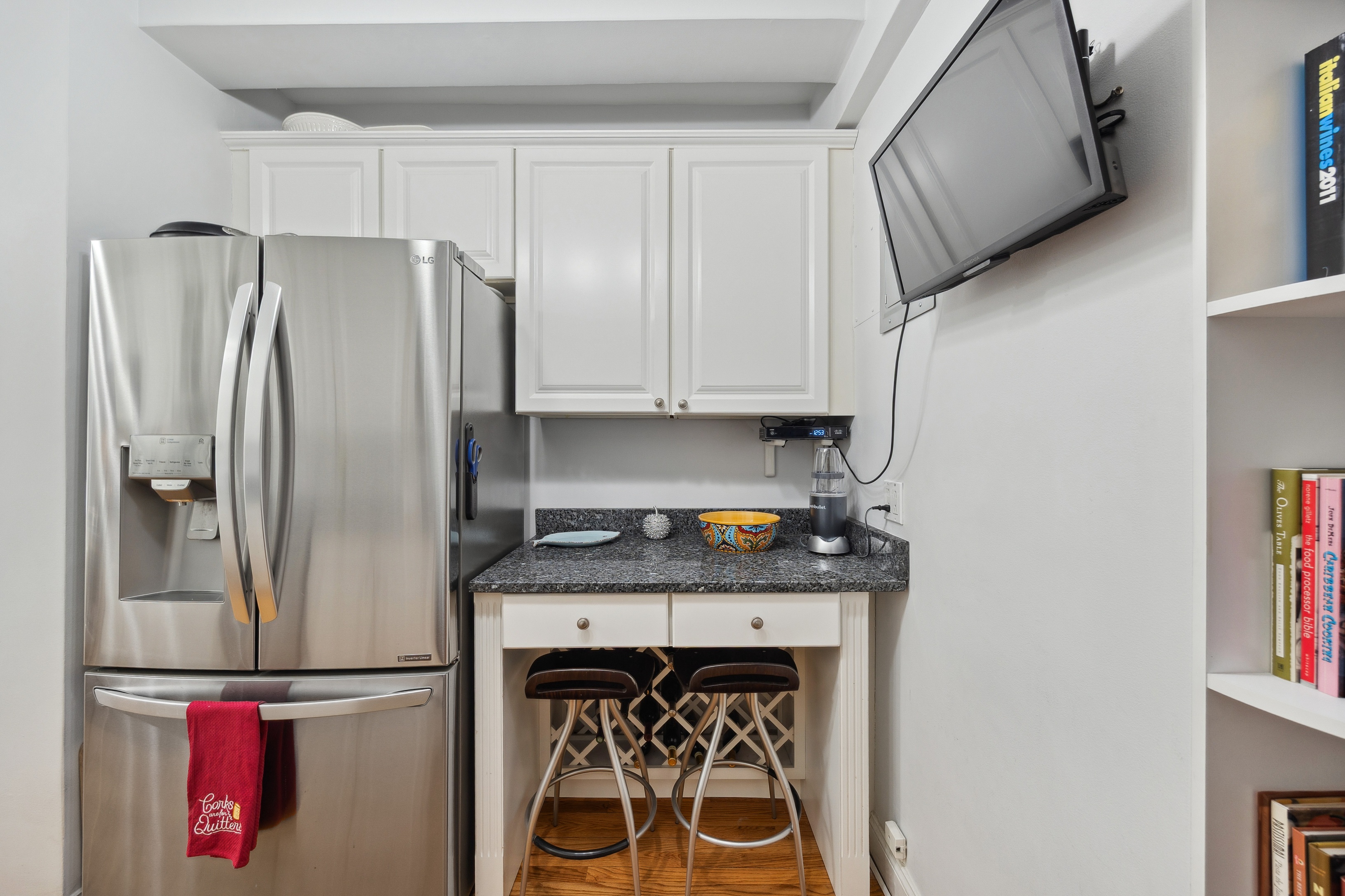 40 West 77th Street, Unit 8C Manhattan, NY 10024 - Photo 8 of 21 a kitchen with stainless steel appliances granite countertop a refrigerator and a stove