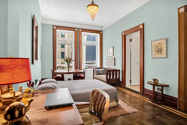 284 5th Avenue, Unit 5F Manhattan, NY 10001 - Photo 4 of 19 a living room with furniture gym equipment and a window