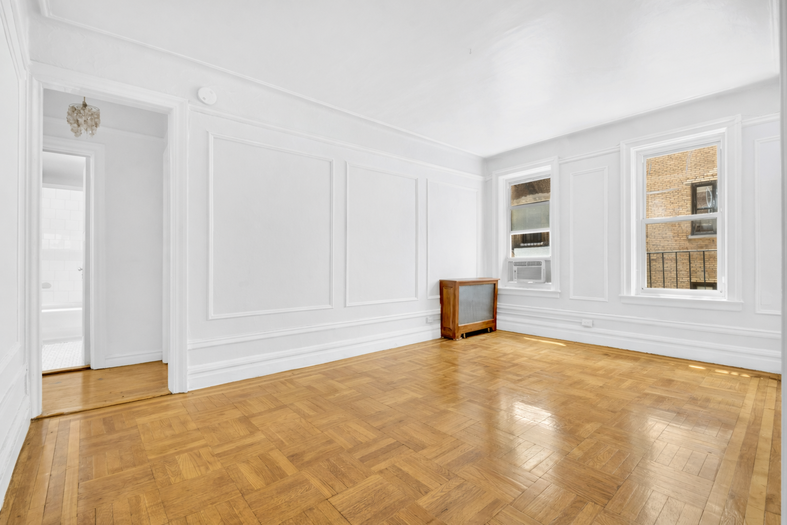 720 West 173rd Street, Unit 23 Manhattan, NY 10032 - Photo 2 of 10 a view of an empty room with a window