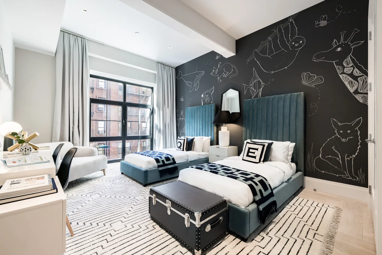 a bedroom with two beds and a couch