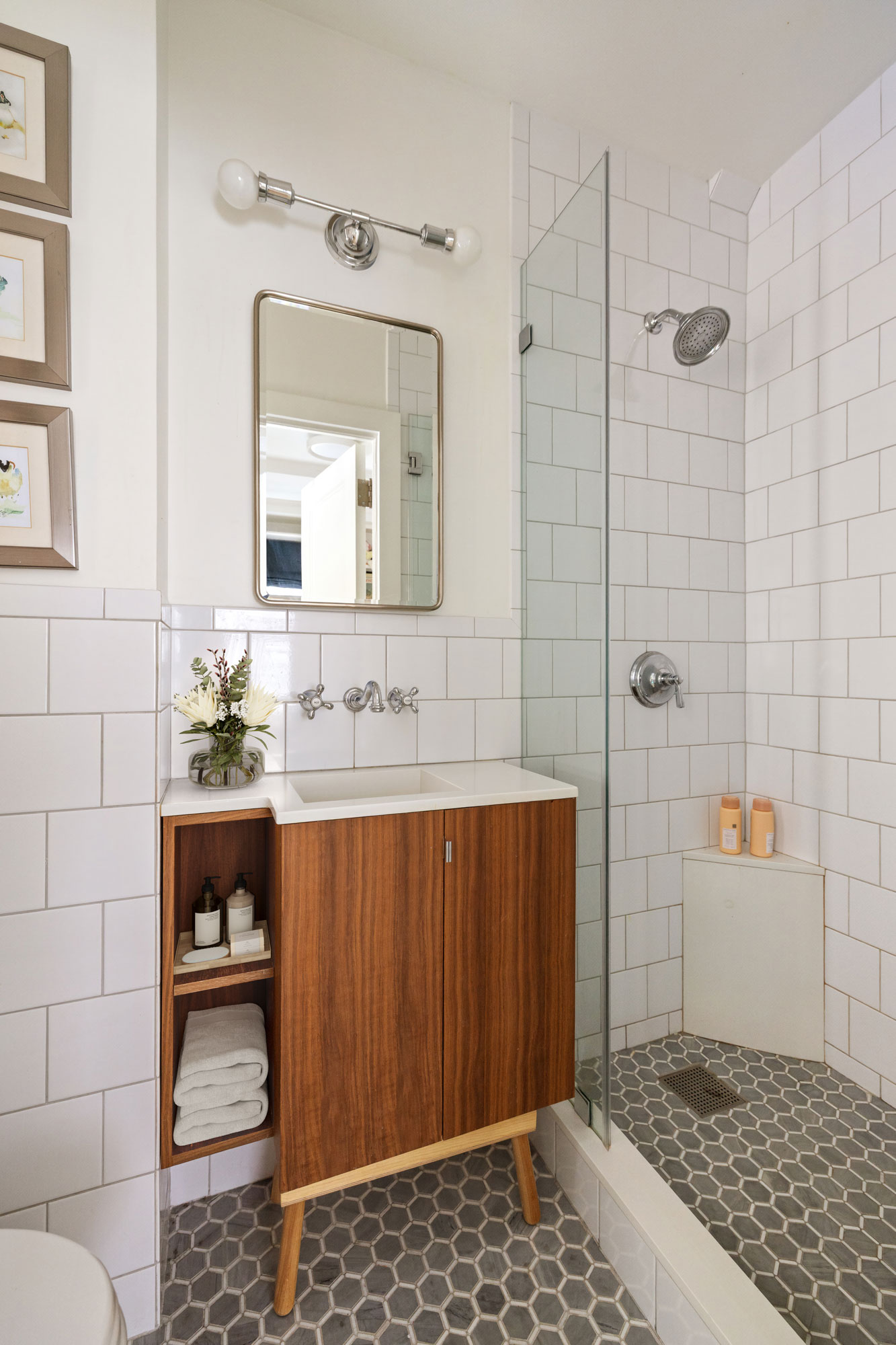 129 East 82nd Street, Unit 1C Manhattan, NY 10028 - Photo 9 of 13 a bathroom with a sink a toilet and shower