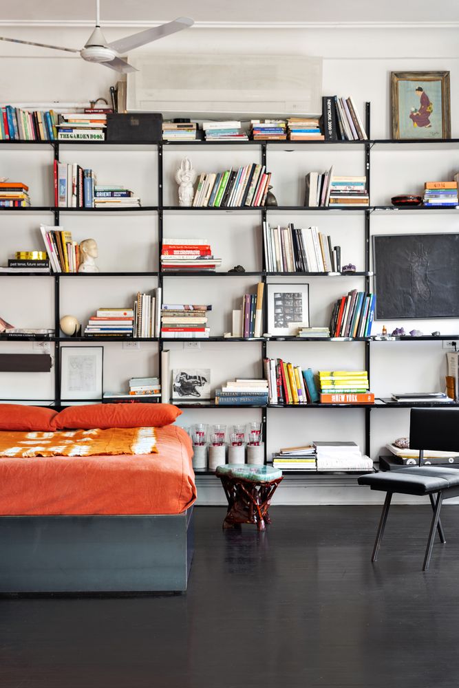 366 Broadway, Unit 5C Manhattan, NY 10013 - Photo 11 of 18 a living room with furniture and a book shelf