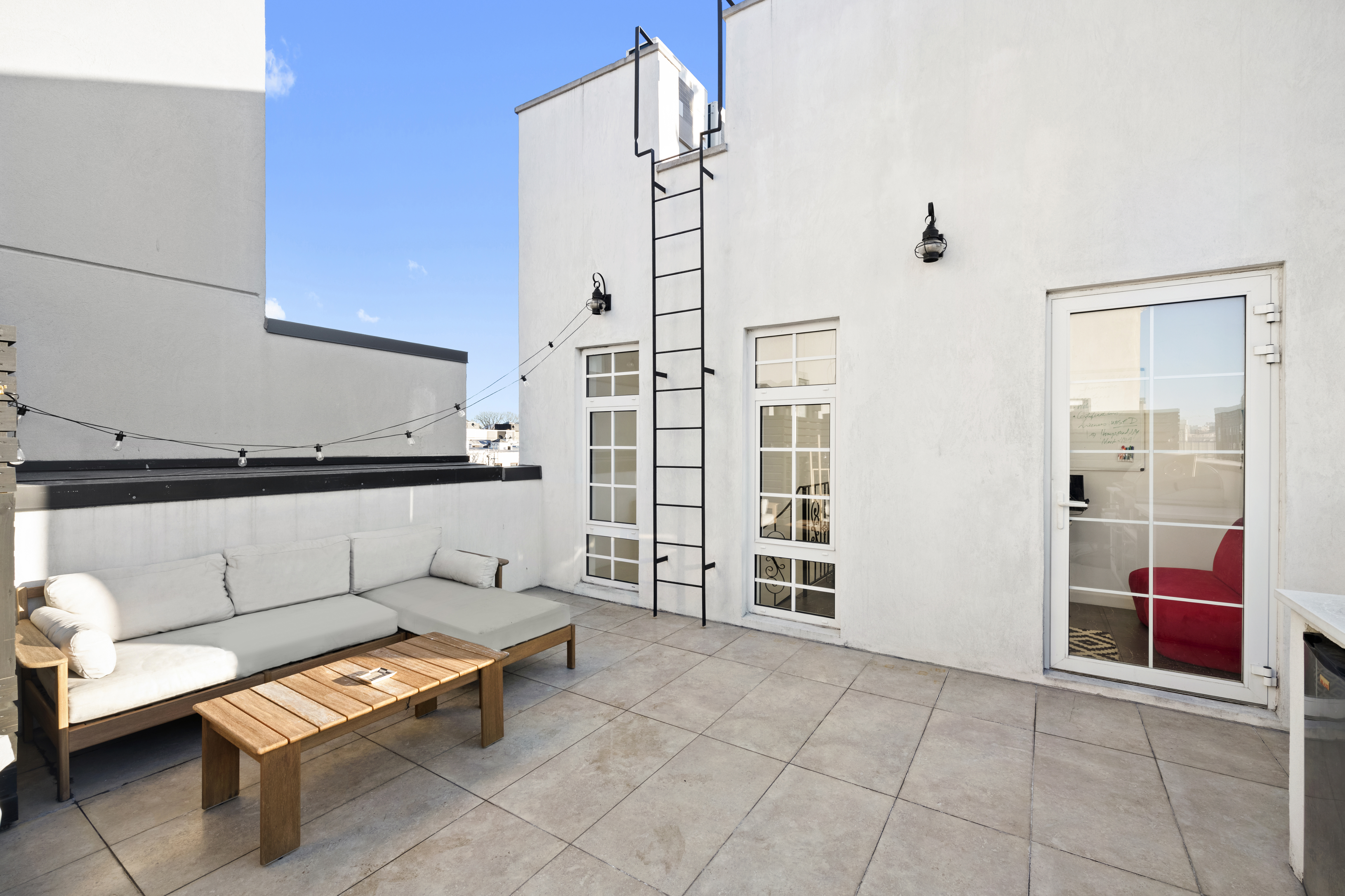 278 Nassau Avenue, Unit 3B Brooklyn, NY 11222 - Photo 9 of 12 a living room with furniture a rug and white walls