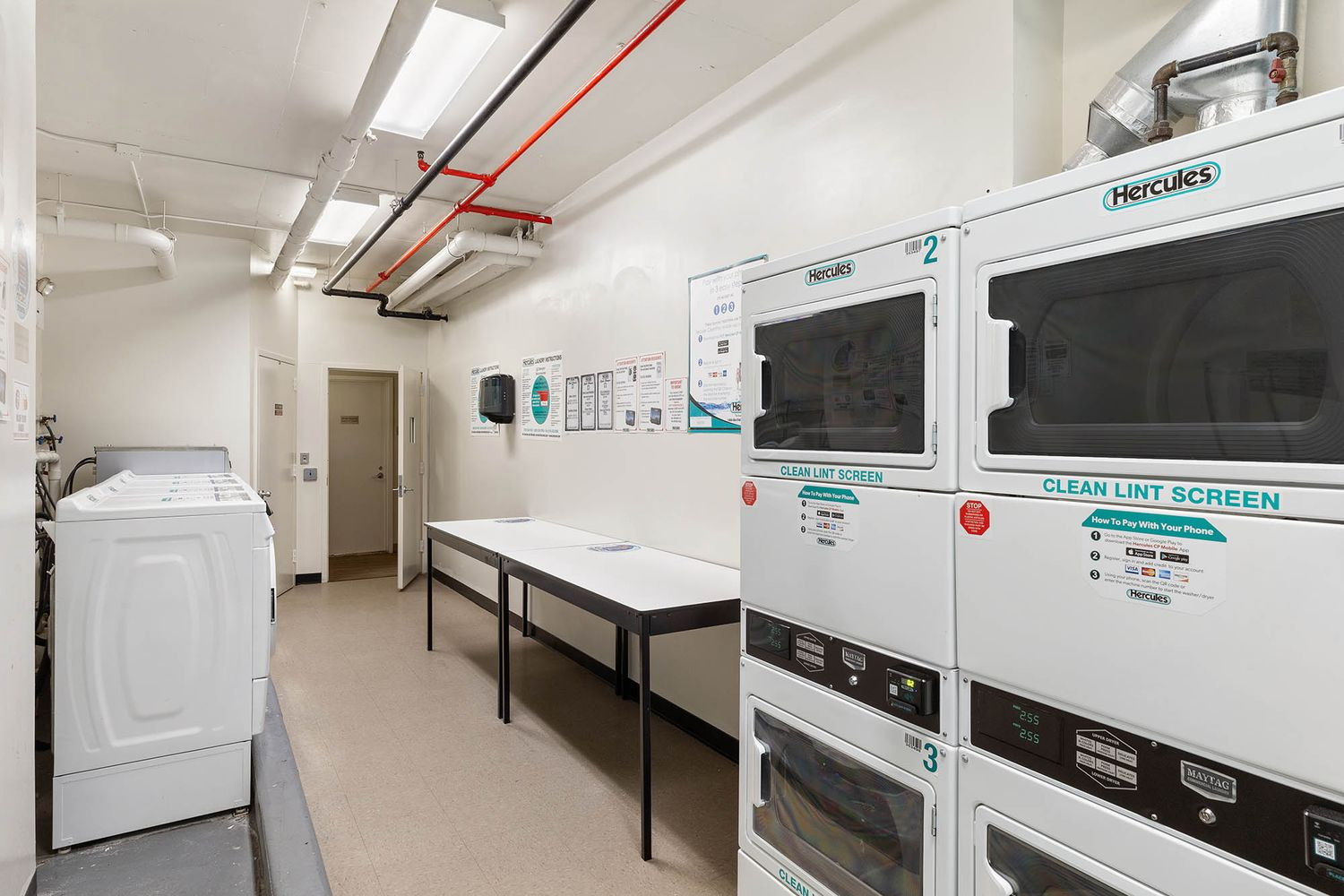 121 East 23rd Street, Unit 4H Manhattan, NY 10010 - Photo 10 of 12 a utility room with washer and dryer