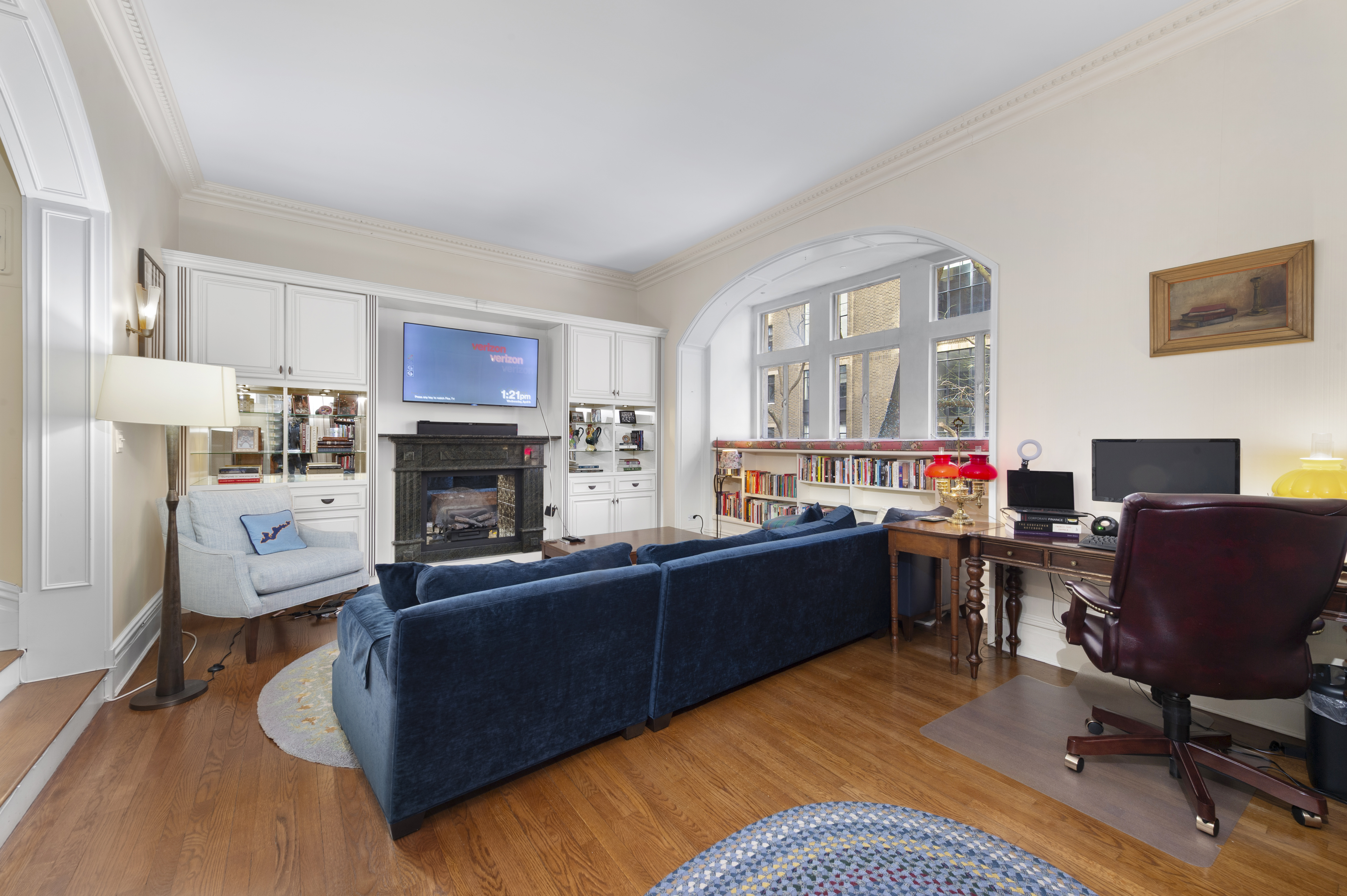 1 West 67th Street, Unit 2M Manhattan, NY 10023 - Photo 2 of 15 a view of a livingroom with furniture and a fireplace