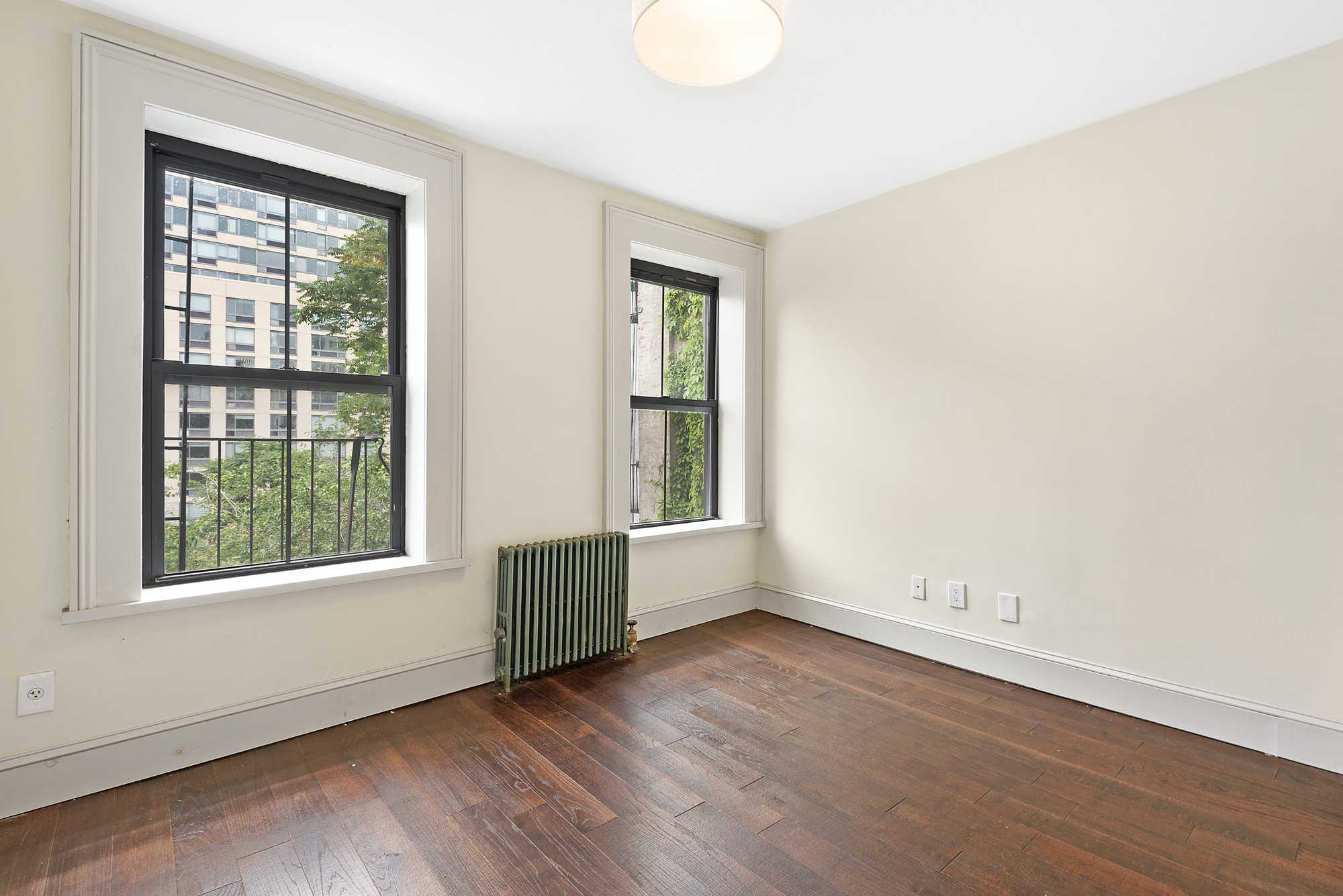 41 Duffield Street, Unit 3 Brooklyn, NY 11201 - Photo 4 of 7 an empty room with wooden floor and windows