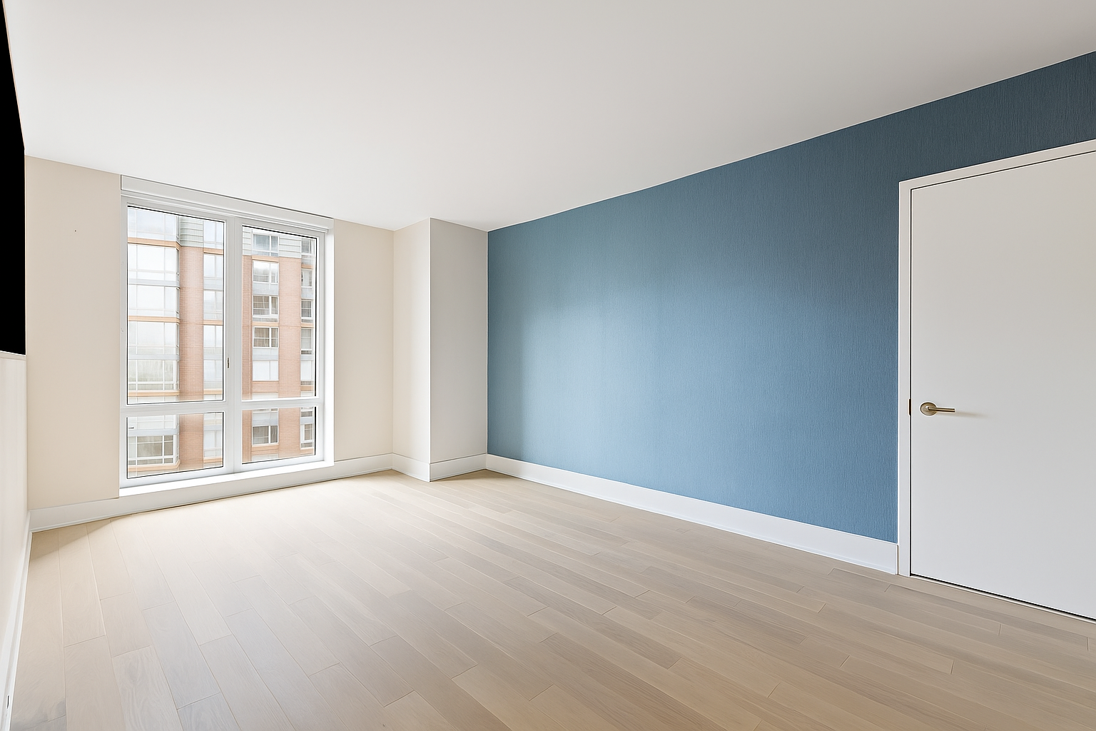 20 River Terrace, Unit 22A Manhattan, NY 10282 - Photo 4 of 27 a view of an empty room with wooden floor and a window