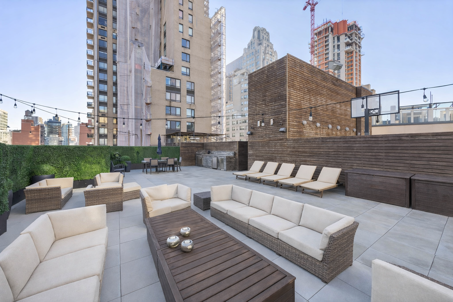 157 East 84th Street, Unit THA Manhattan, NY 10028 - Photo 3 of 33 a view of a roof deck with couches and potted plants