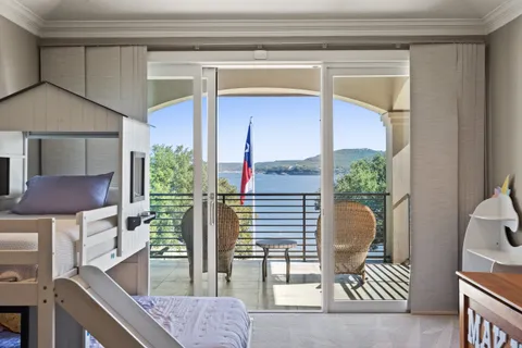 a front view of house with outdoor space and swimming pool