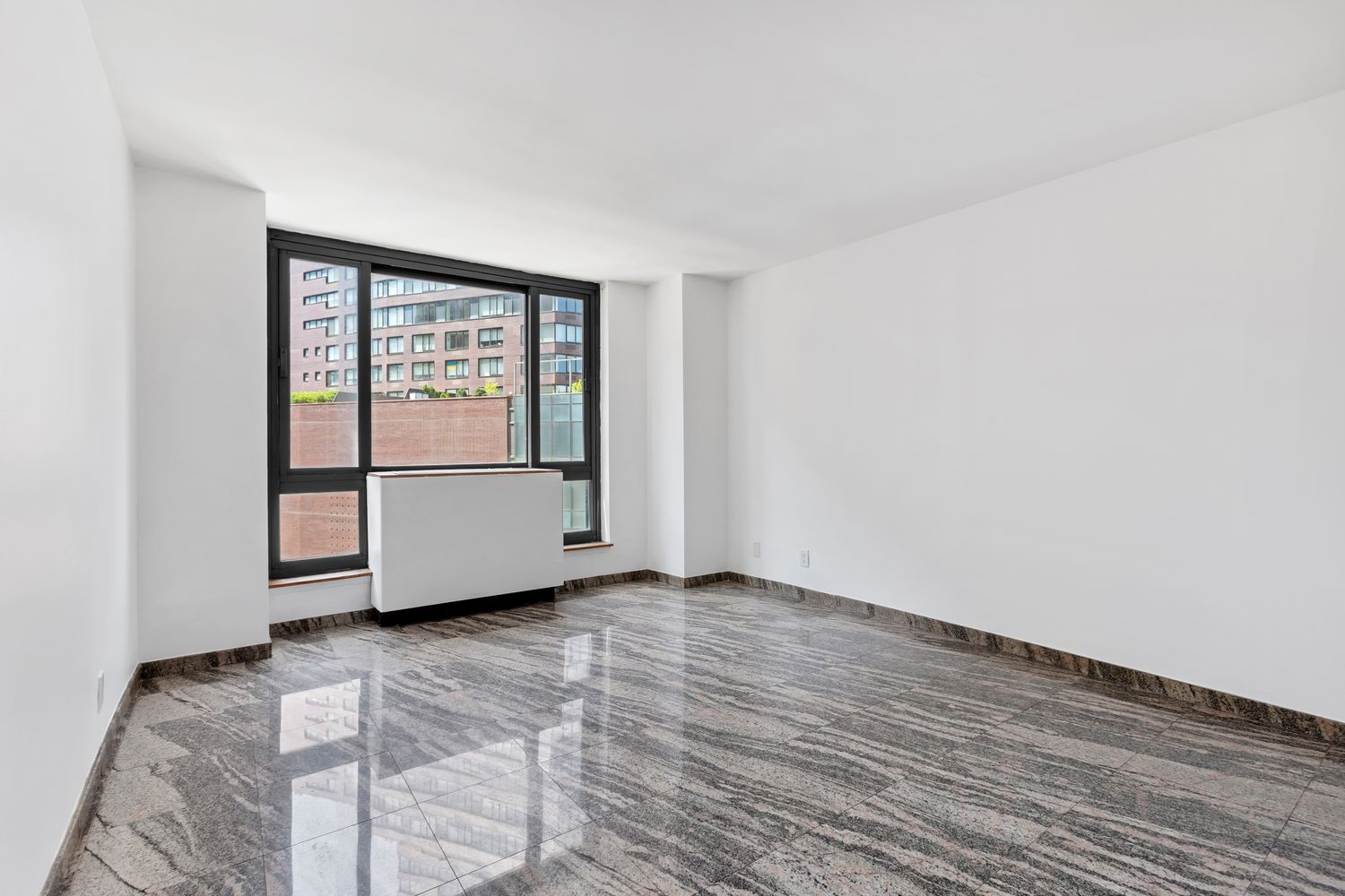 1 Irving Place, Unit U7BC Manhattan, NY 10003 - Photo 8 of 20 a view of an empty room with wooden floor and a window