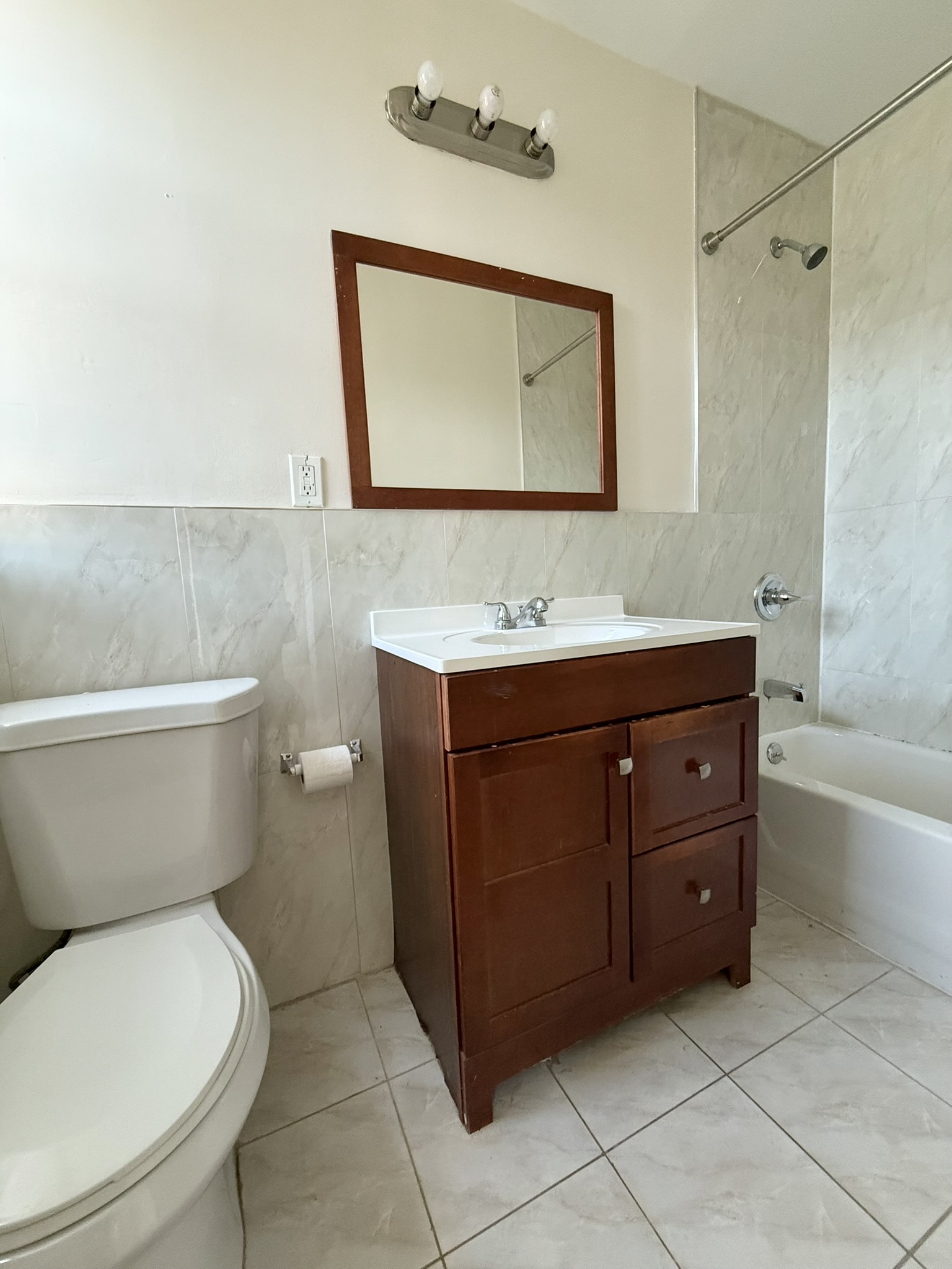 196 West 108th Street, Unit 5N Manhattan, NY 10025 - Photo 4 of 5 a bathroom with a toilet sink and mirror
