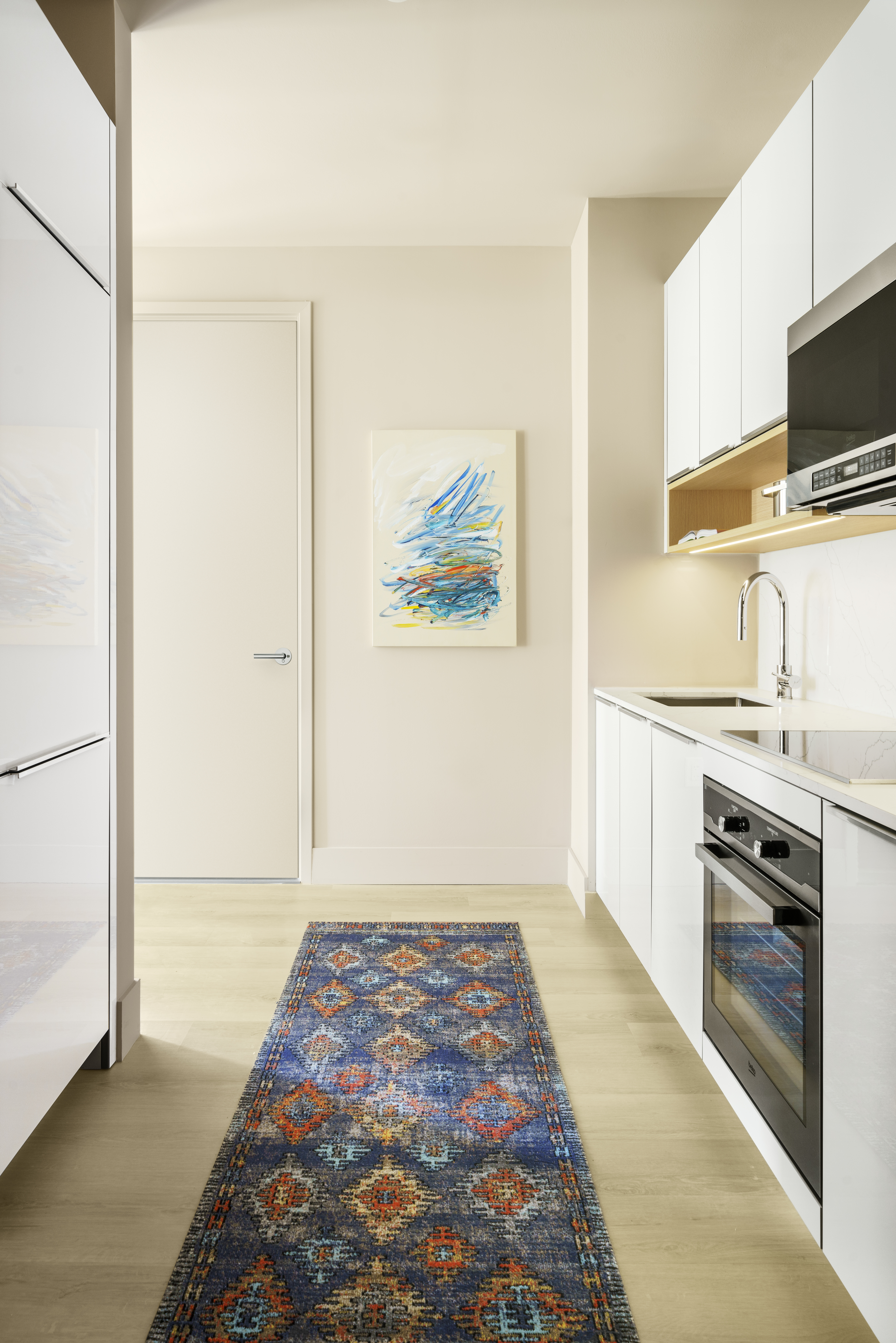 a kitchen with stainless steel appliances granite countertop a refrigerator and a stove top oven