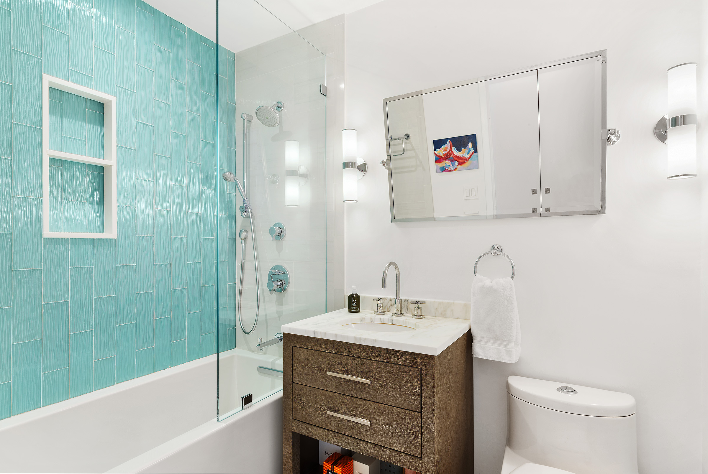 450 West 17th Street, Unit 1003 Manhattan, NY 10011 - Photo 6 of 9 a bathroom with a sink and a mirror