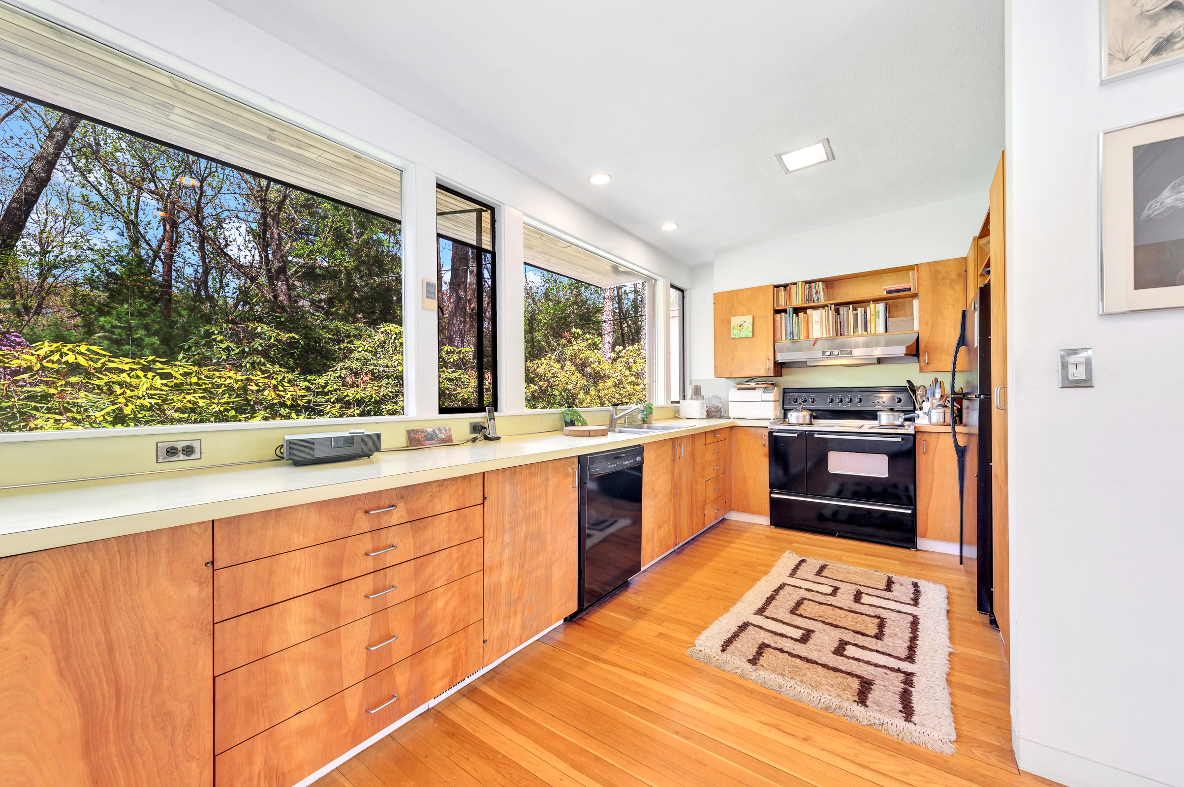 14 Barberry Road Lexington, MA 02421 - Photo 9 of 30 a kitchen with stainless steel appliances kitchen island granite countertop a refrigerator and stove