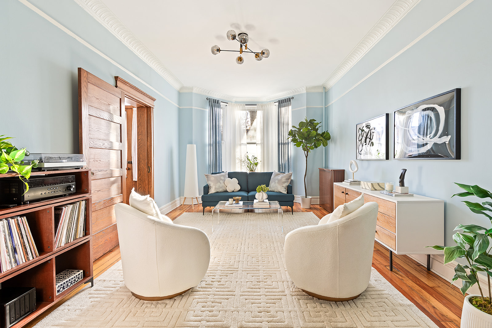 521 84th Street Brooklyn, NY 11209 - Photo 1 of 19 a living room with furniture a bookshelf and a window