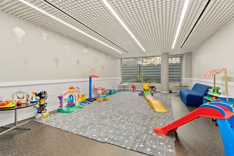 a view of living room with furniture and toys