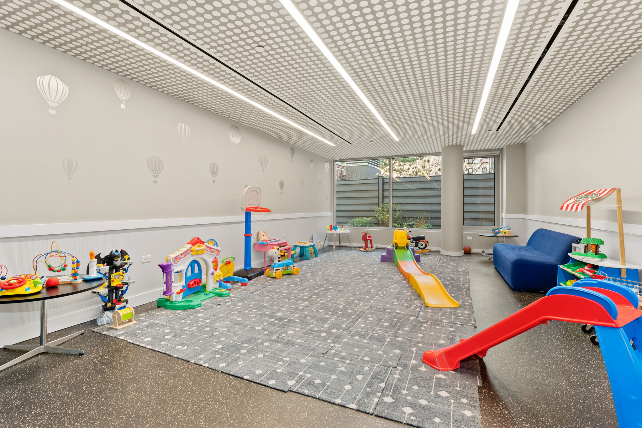 425 West 53rd Street, Unit 416 Manhattan, NY 10019 - Photo 16 of 19 a view of living room with furniture and toys
