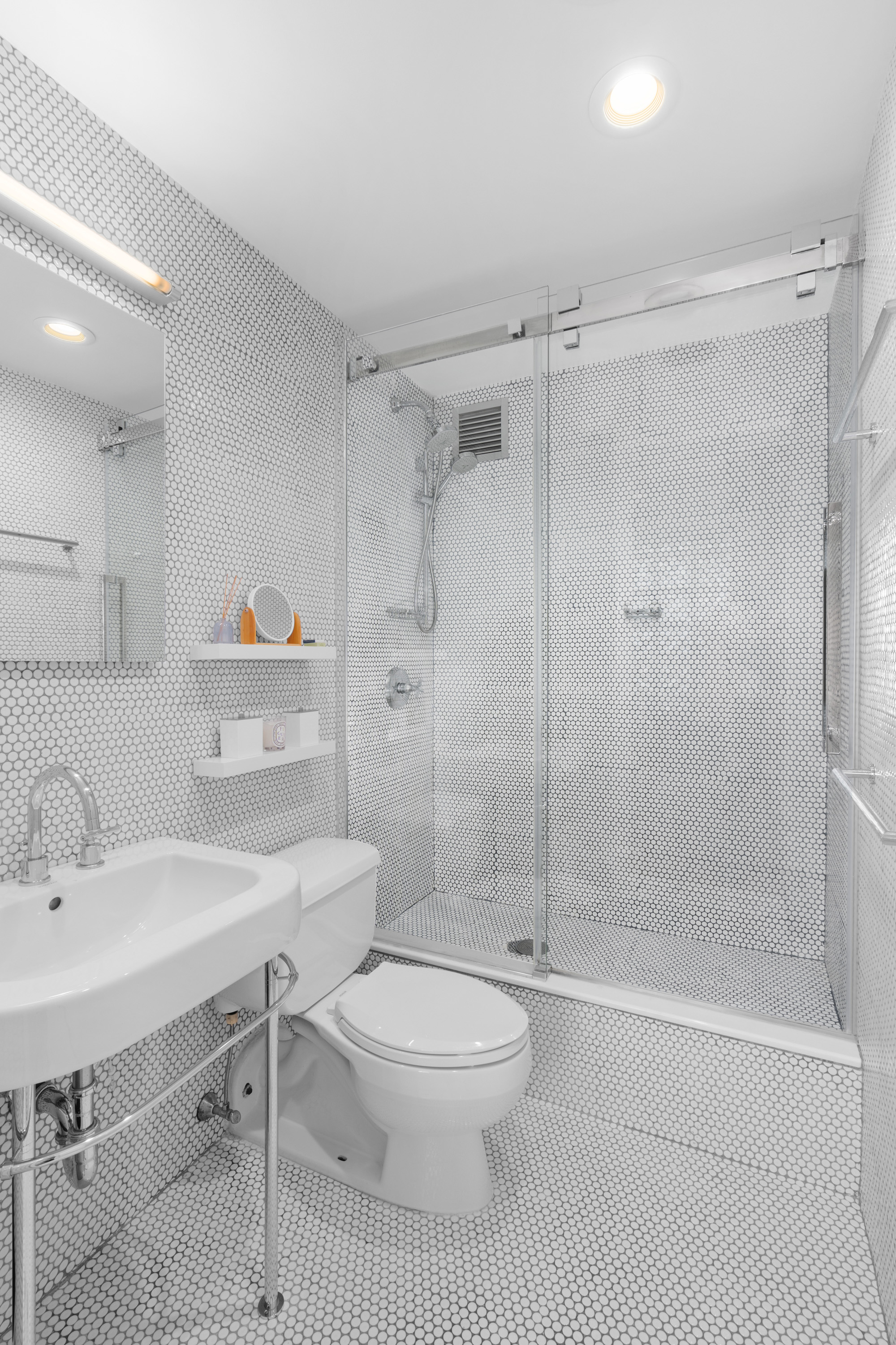 425 Park Avenue South, Unit 20D Manhattan, NY 10016 - Photo 6 of 7 a bathroom with a sink toilet and shower