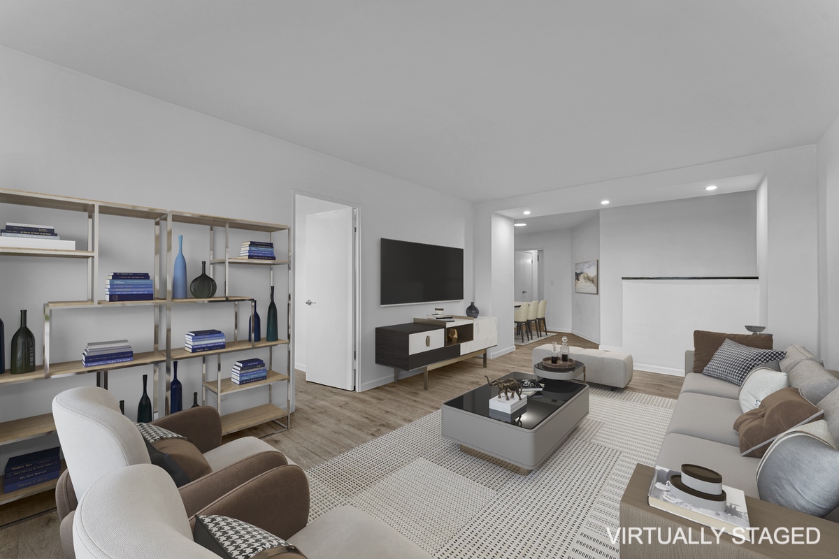 5800 Arlington Avenue, Unit 3X Bronx, NY 10471 - Photo 1 of 11 a living room with furniture or couch and a flat screen tv