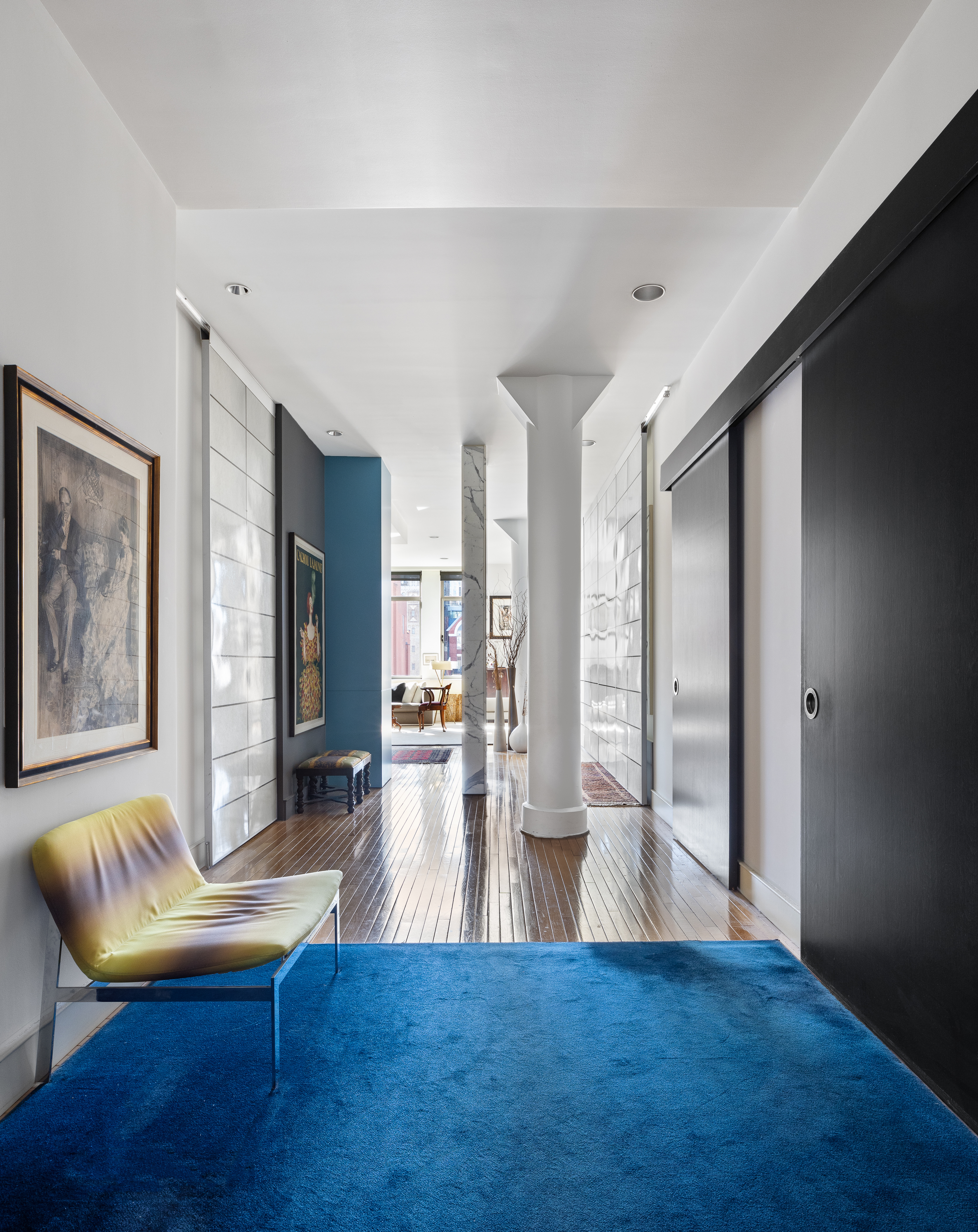 252 7th Avenue, Unit 9X Manhattan, NY 10001 - Photo 9 of 26 a living room with fireplace furniture and a wooden floor