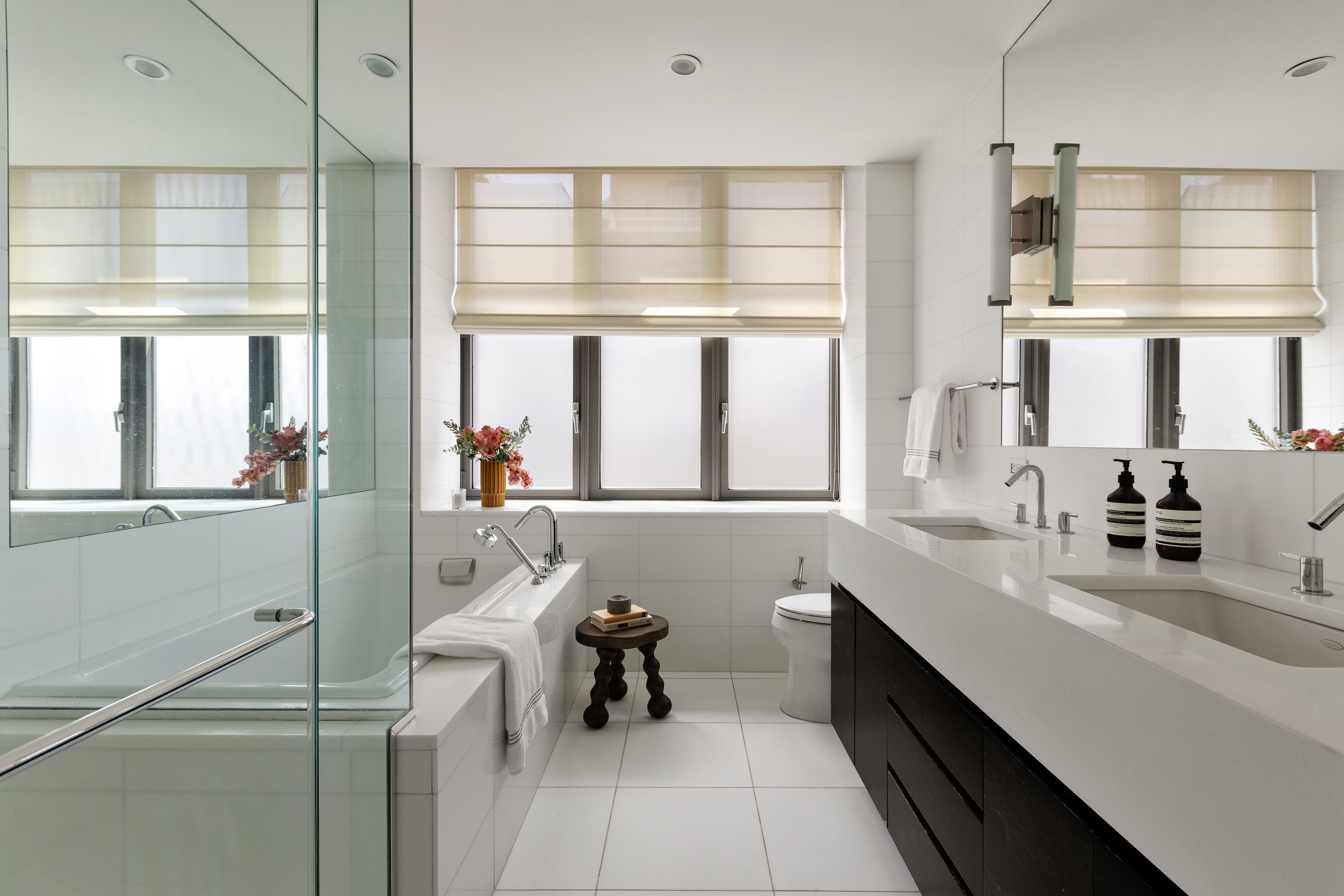 4 West 21st Street, Unit 16A Manhattan, NY 10010 - Photo 6 of 15 a bathroom with a sink a mirror and next to a window